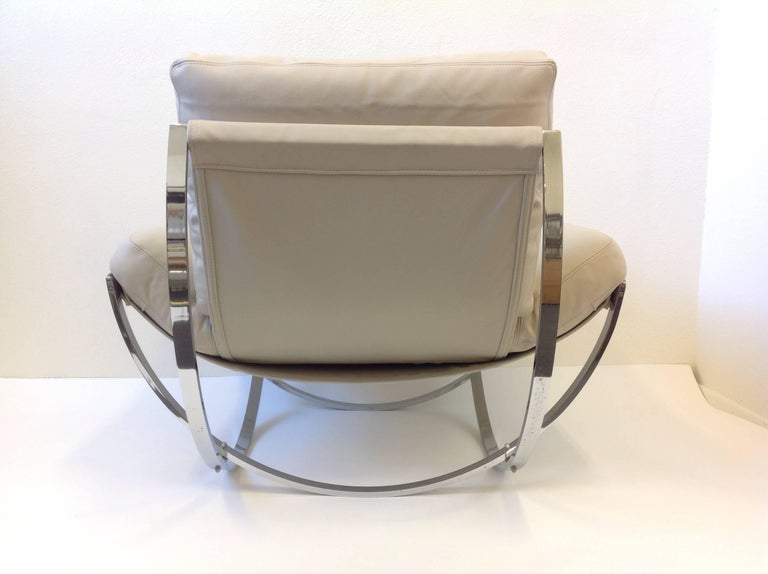 Italian Polish Stainless Steel and Leather Lounge Chair and Ottoman at