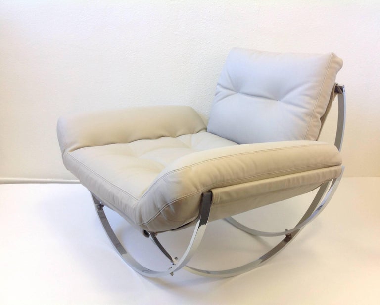 Italian Polish Stainless Steel and Leather Lounge Chair and Ottoman at