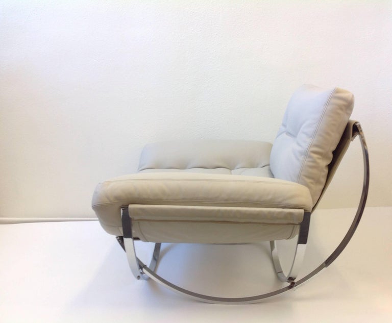 Italian Polish Stainless Steel and Leather Lounge Chair and Ottoman at