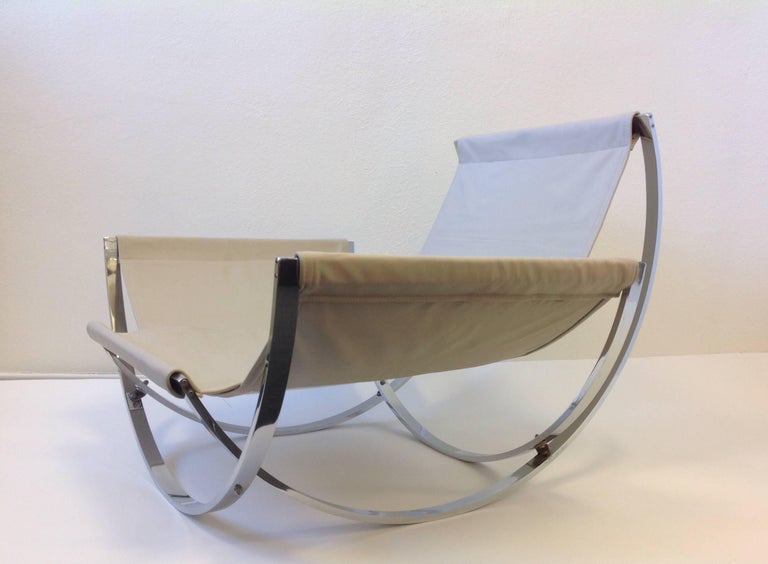 Italian Polish Stainless Steel and Leather Lounge Chair and Ottoman at