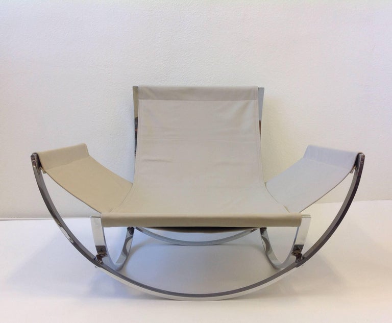 Italian Polish Stainless Steel and Leather Lounge Chair and Ottoman at