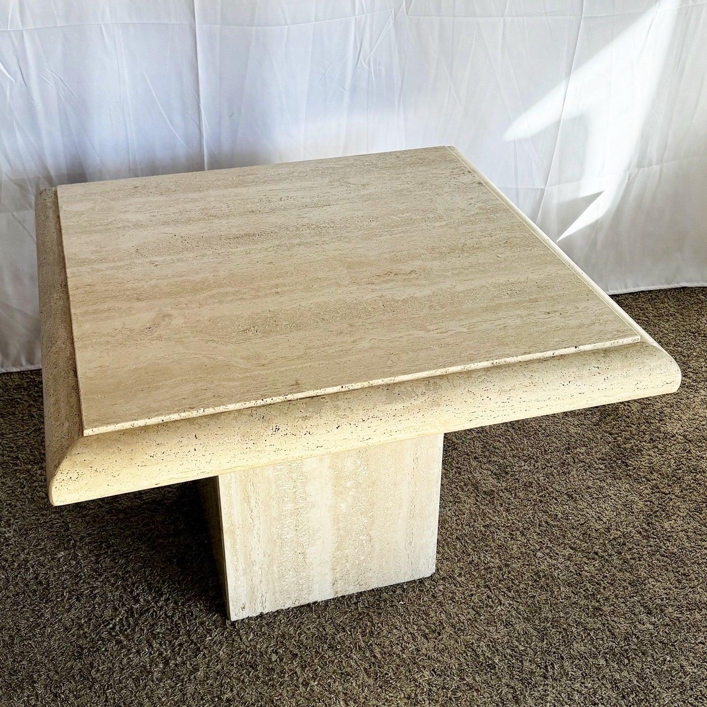 Elevate your space with the Italian Travertine Side Table, featuring a polished square top and pedestal base for timeless elegance.
 
 Some wear to the polish which can’t be shown in the photos.
 
 We sell items as acquired, without restoring or