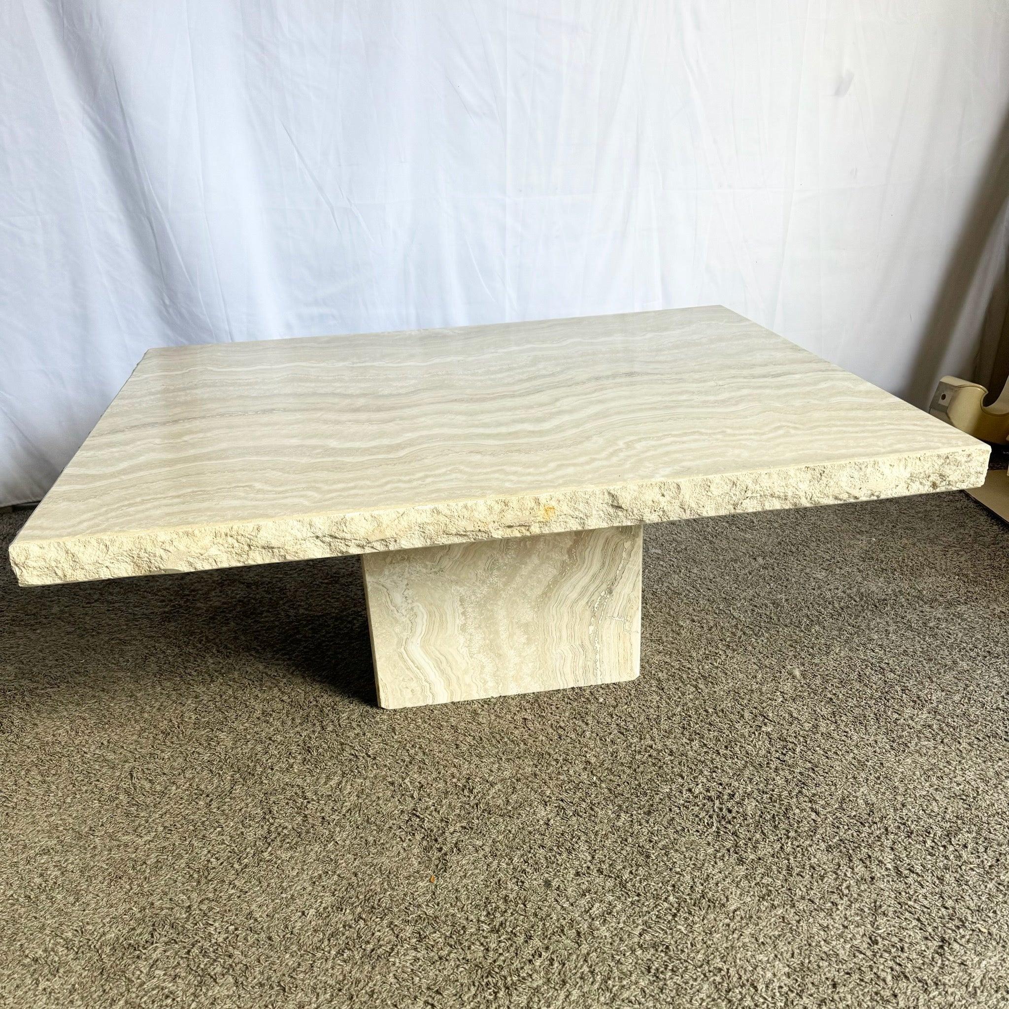 Italian polished travertine coffee table with raw-edge detailing and sculptural pedestal base—natural elegance for modern interiors.
 
 We sell items as acquired, without restoring or repairing. Vintage pieces may have age-related wear. Review