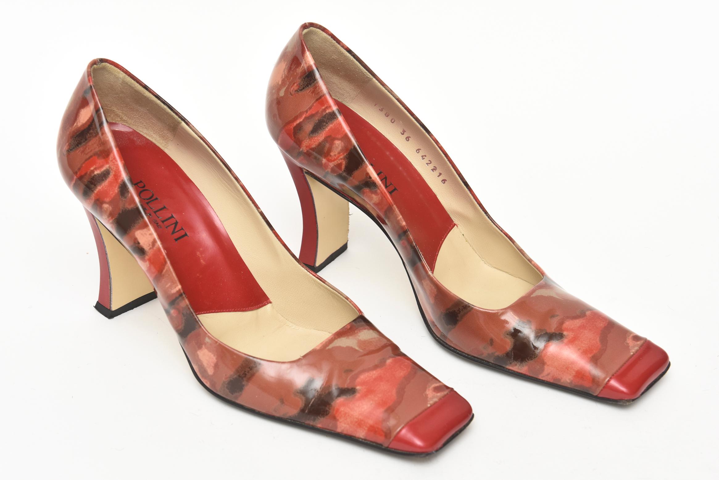 These pair of sexy graphic printed patent leather square toe heels are italian and from the company called Pollini Their 3 inch heel is a sculpted indentation and very au courant. It looks like a great abstract painting on a shoe. Gorgeous color and