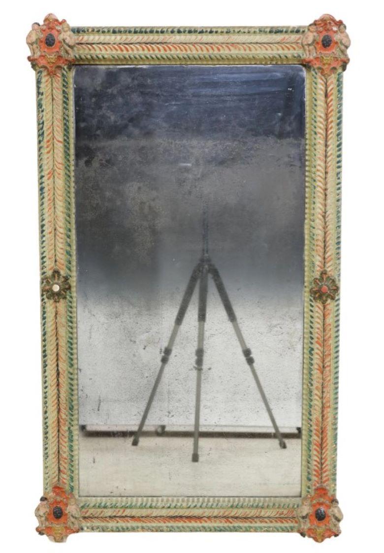 19th Century polychrome painted Italian mirror. Molded frame with putti supporting four corners, cartouche shield and cherubim decals. Losses to silvering on mirror plate as pictured. 