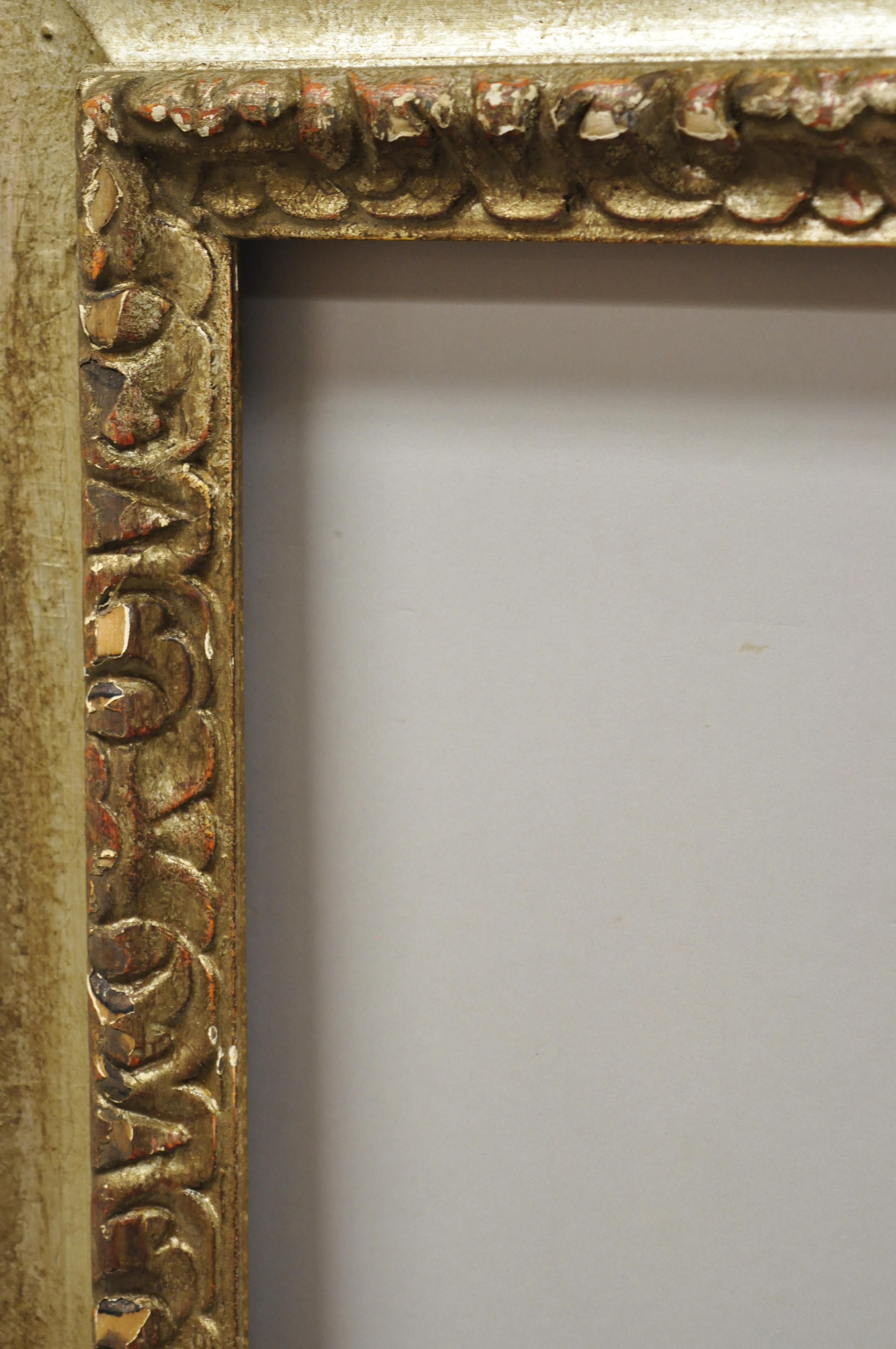Antique Italian polychrome parcel gilt carved wood Florentine painting frame. Item features distressed polychrome painted gold/silver gilt finish, solid wood frame, hand carved details, desirable distressed/weathered old world finish, circa
