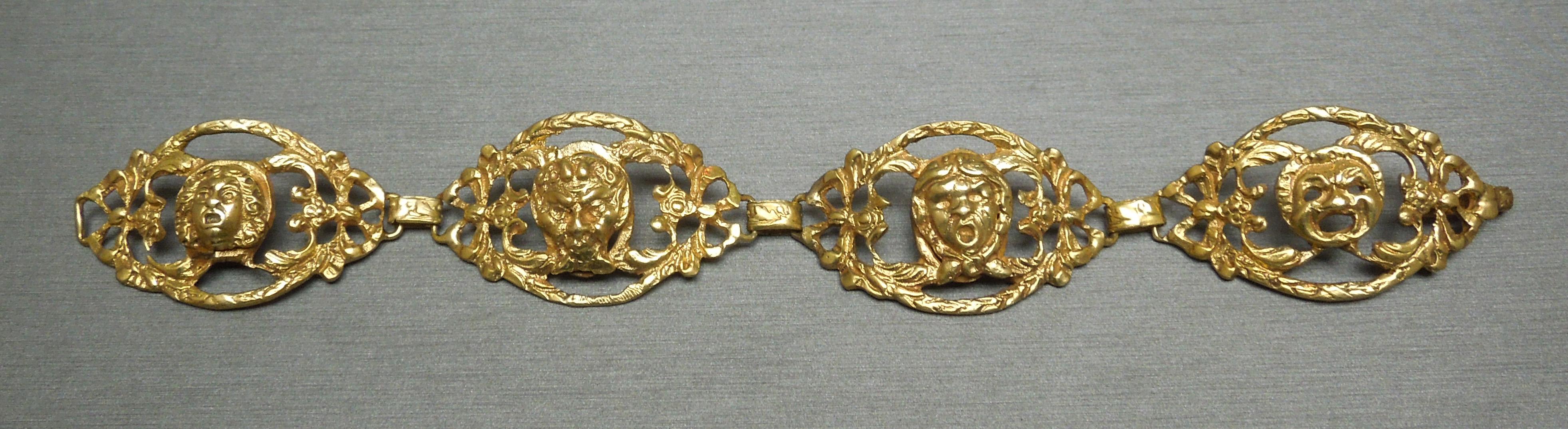 From a local New Orleans estate, the design of this bracelet was attributed to the historic Orpheum Theater. Constructed completely of 800 Silver, accented with a Gold Plating for the 24 Karat Gold look.. Depicting four Roman heads in a detailed
