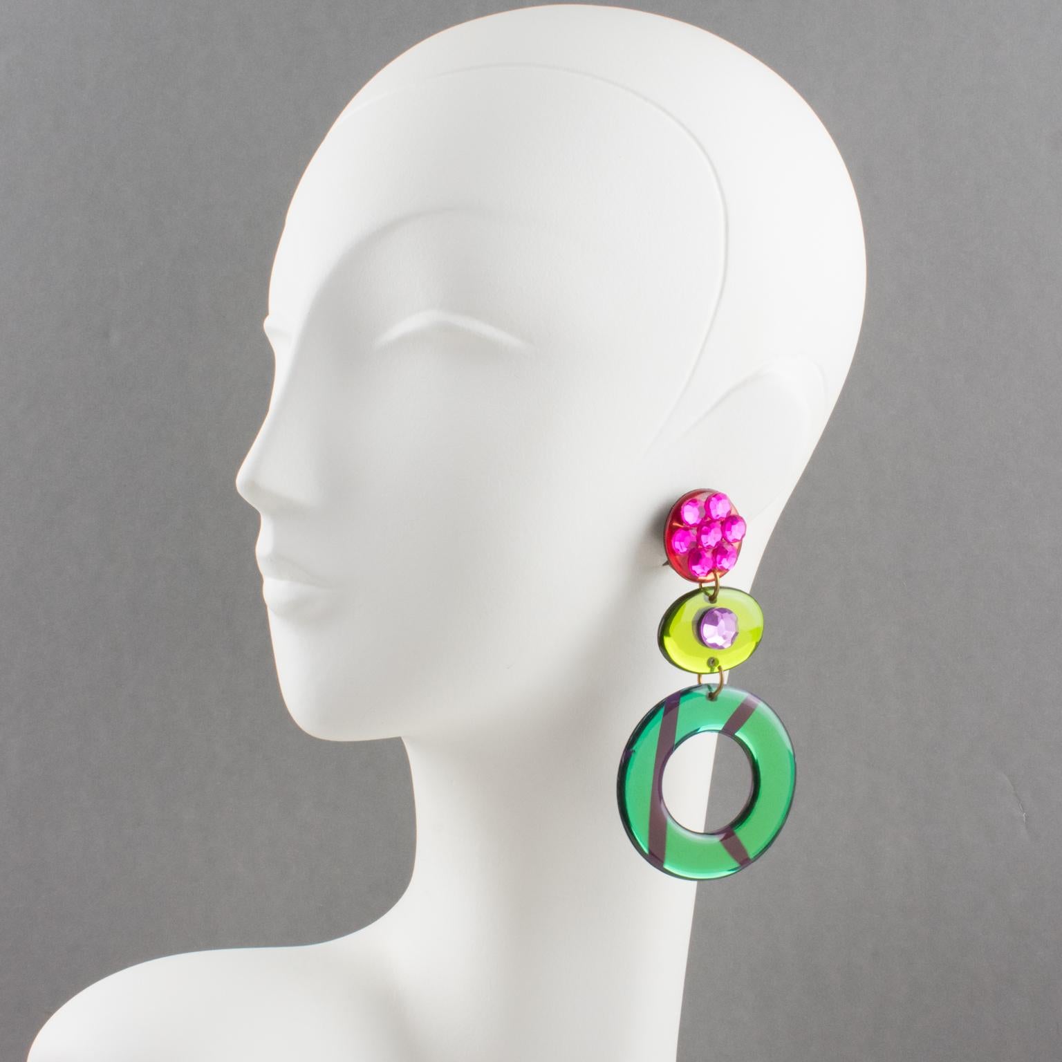 Stunning Italian designer studio Lucite or Resin dangling clip-on earrings. Oversized chandelier design with ovoid and donut shape in emerald green, apple green and salmon pink colors with mirror effect and textured pattern. Earrings are also ornate