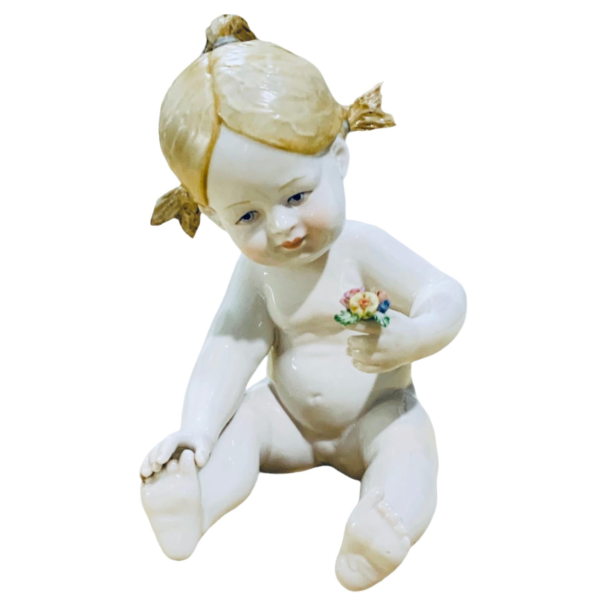 Italian Porcelain Baby Girl Piano Figurine For Sale