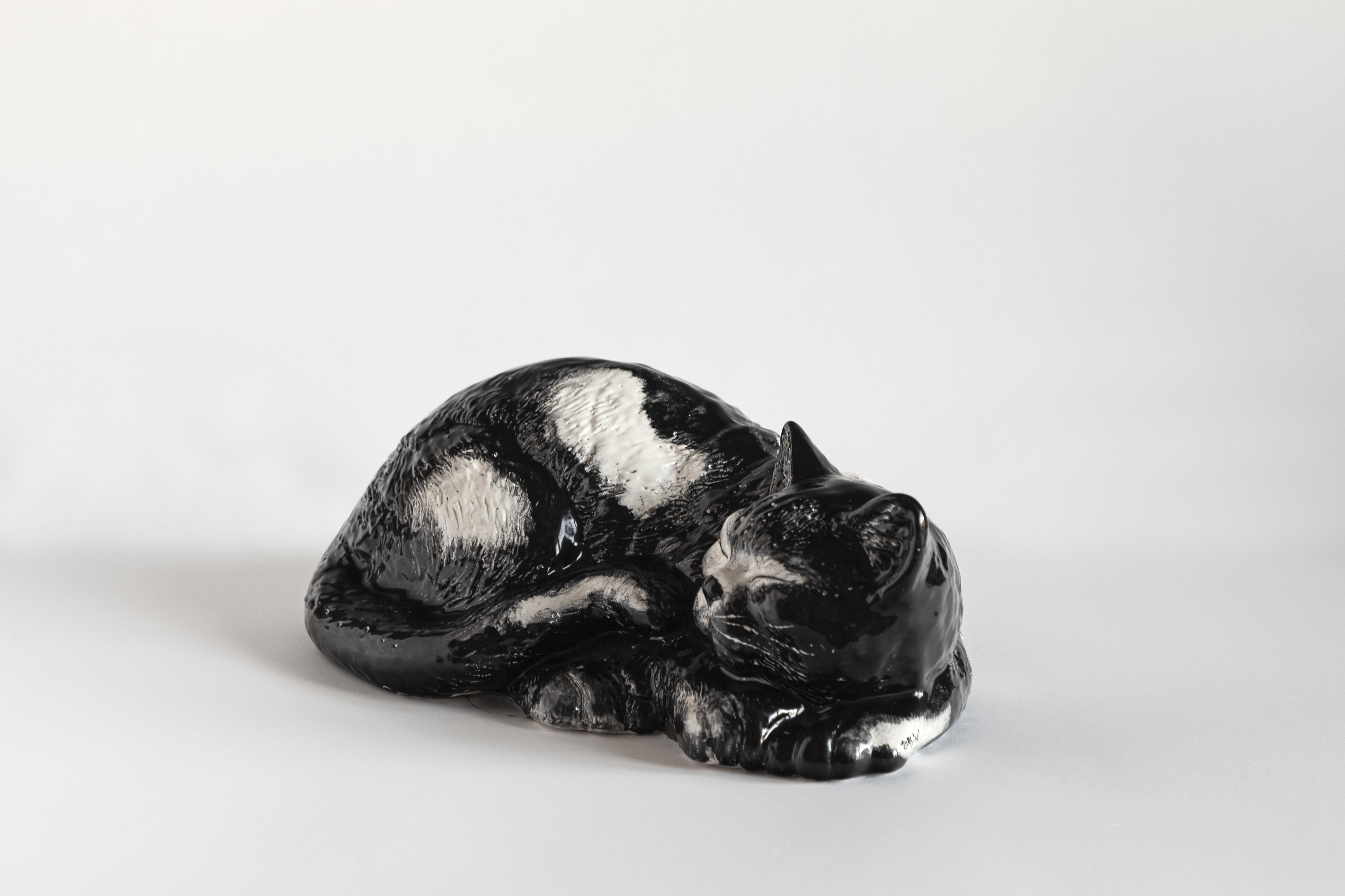 This Italian porcelain sculpture is part of Grand Tour by Vito Nesta. Made of Capodimonte porcelain with a glossy finish, this sculpture is shaped like a sleeping cat and was inspired by Romolo, Vito's cat.