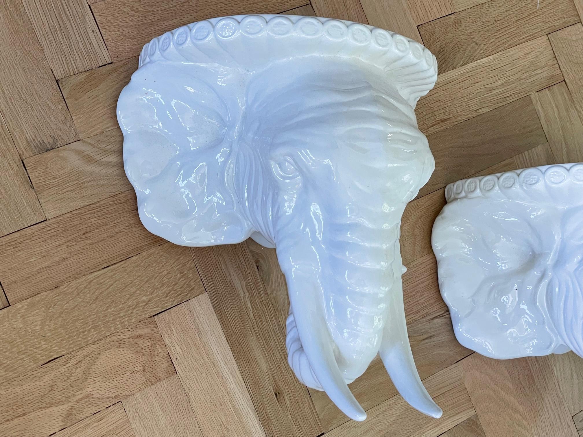 Pair of sculptural elephant wall shelves made in Italy. Heavy glaze and bright white finish. Good condition, no chips or cracks.

  