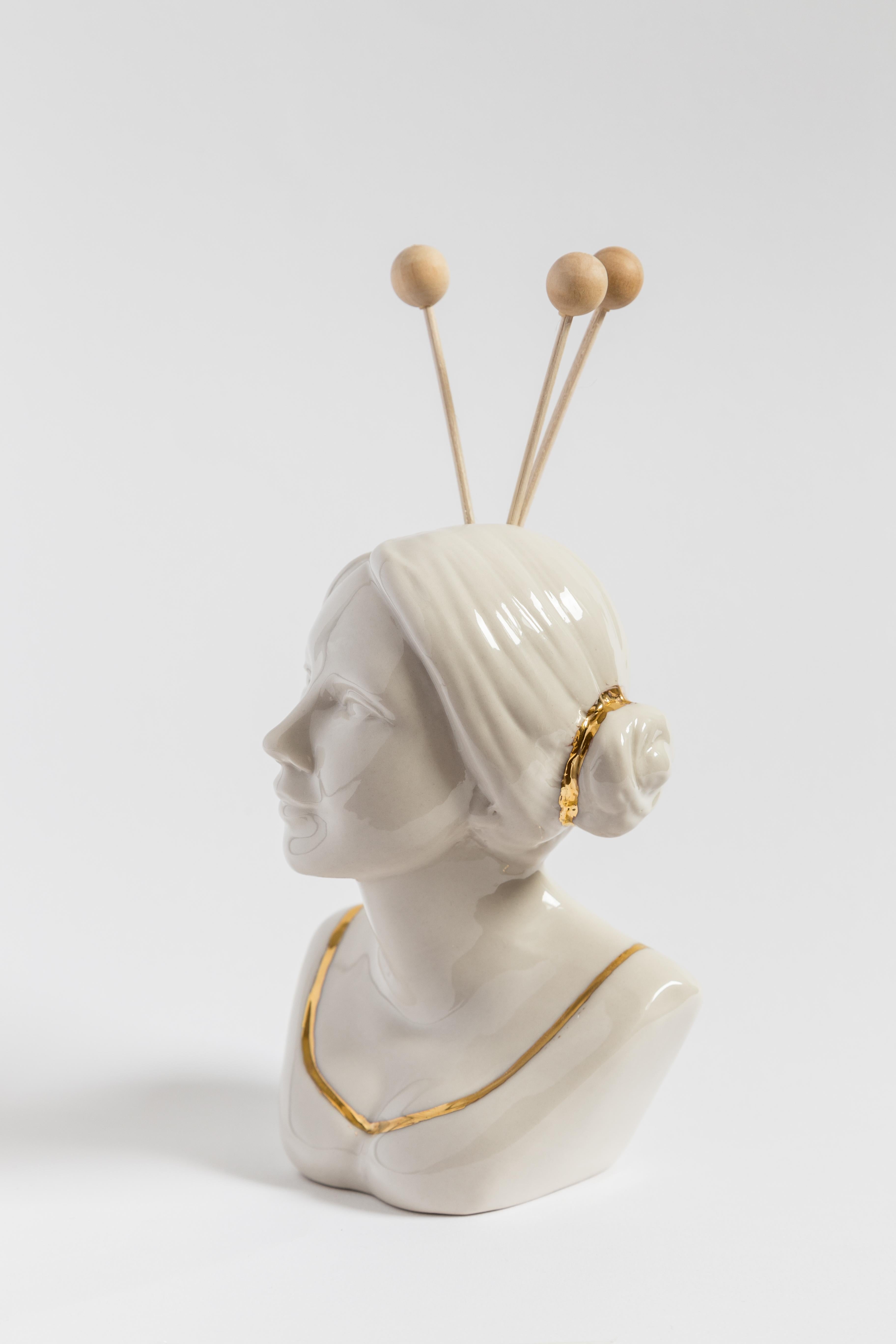 This Italian porcelain sculpture is part of Grand Tour by Vito Nesta. Made in Capodimonte porcelain with a glossy finish and gold detail, this sculpture is an essential oil diffuser and is shaped like a Spanish woman.