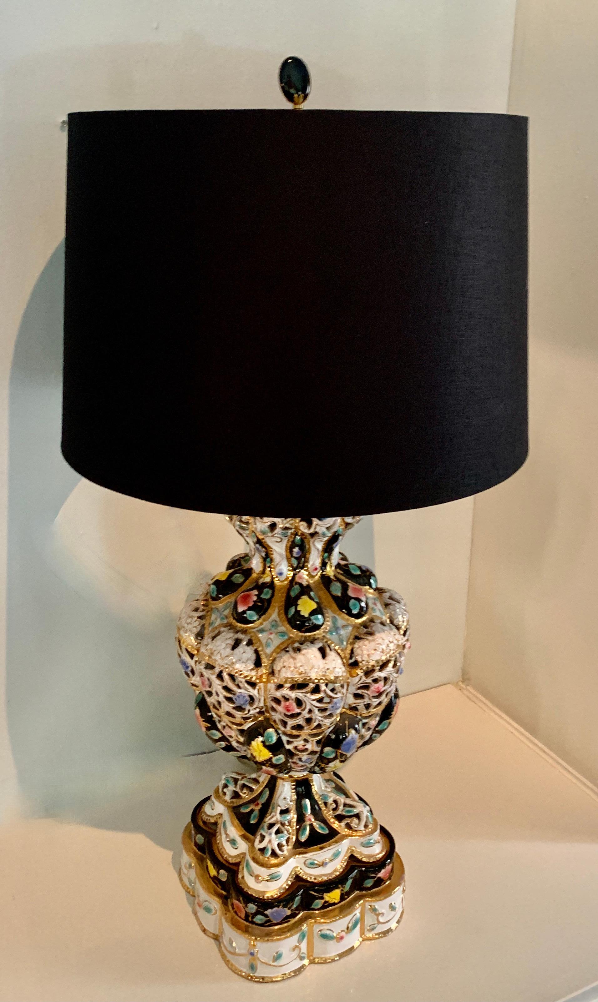 A wonderfully colorful table lamp in the style of Capodimonte. The lamp is a compliment to any artistic decor - so gaudy it's a classic piece of art. The lamp comes with a silk shade with gold foil interior.

*Measurements in description of this