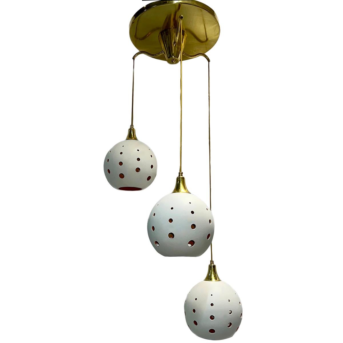 A circa 1960's Italian light fixture with porcelain pendants and interior lights.

Measurements:
Diameter: 24