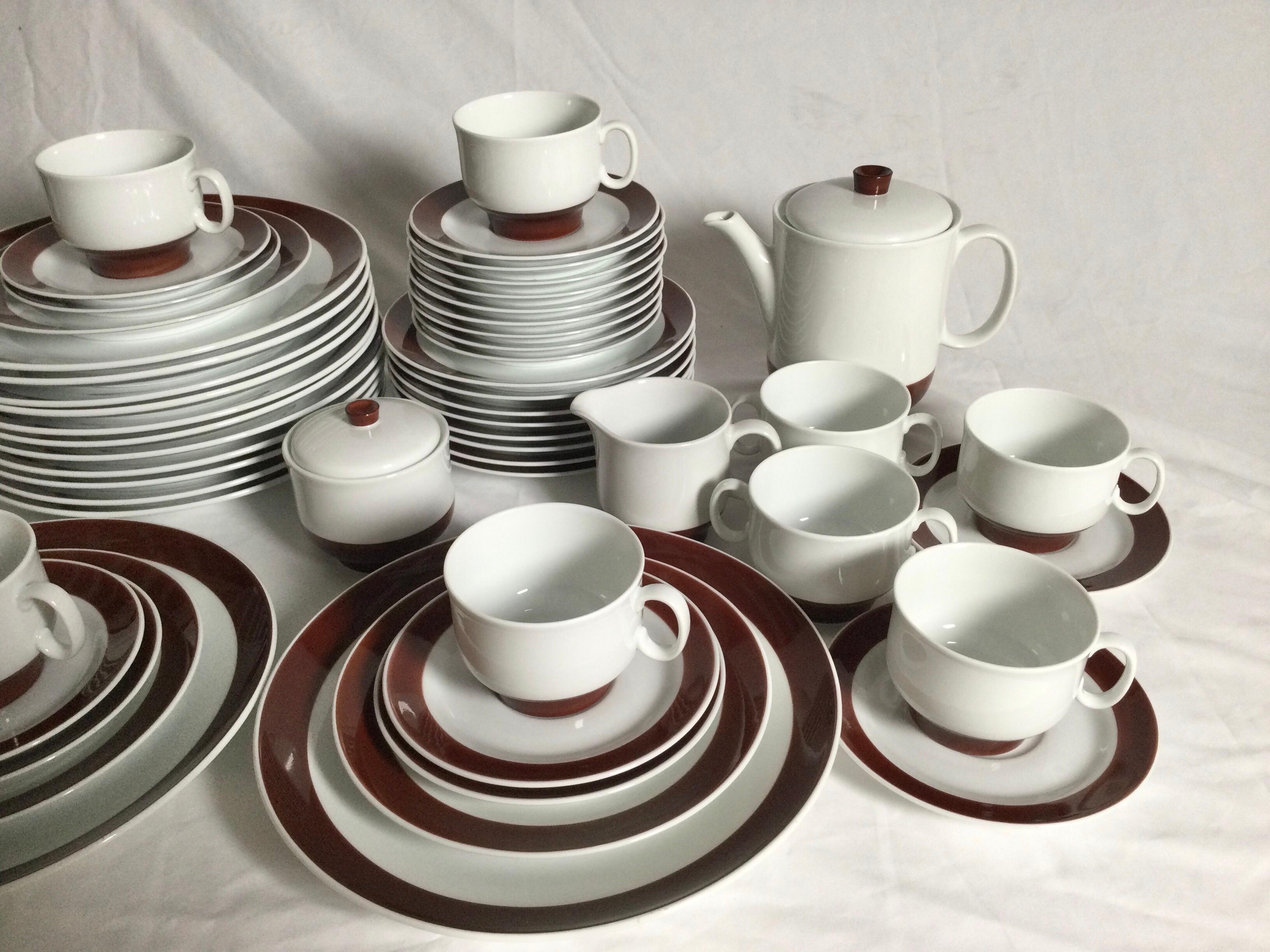 A rare beauty, Richard Ginori Italian porcelain dinnerware set with a rich and bold mocha stripe. The set consisting of 12 dinner plates, 12 salad plates, 12 dessert plates, 8 soup bowls, 10 footed cups, 9 saucers, 2 cream soup bowl, 1 covered