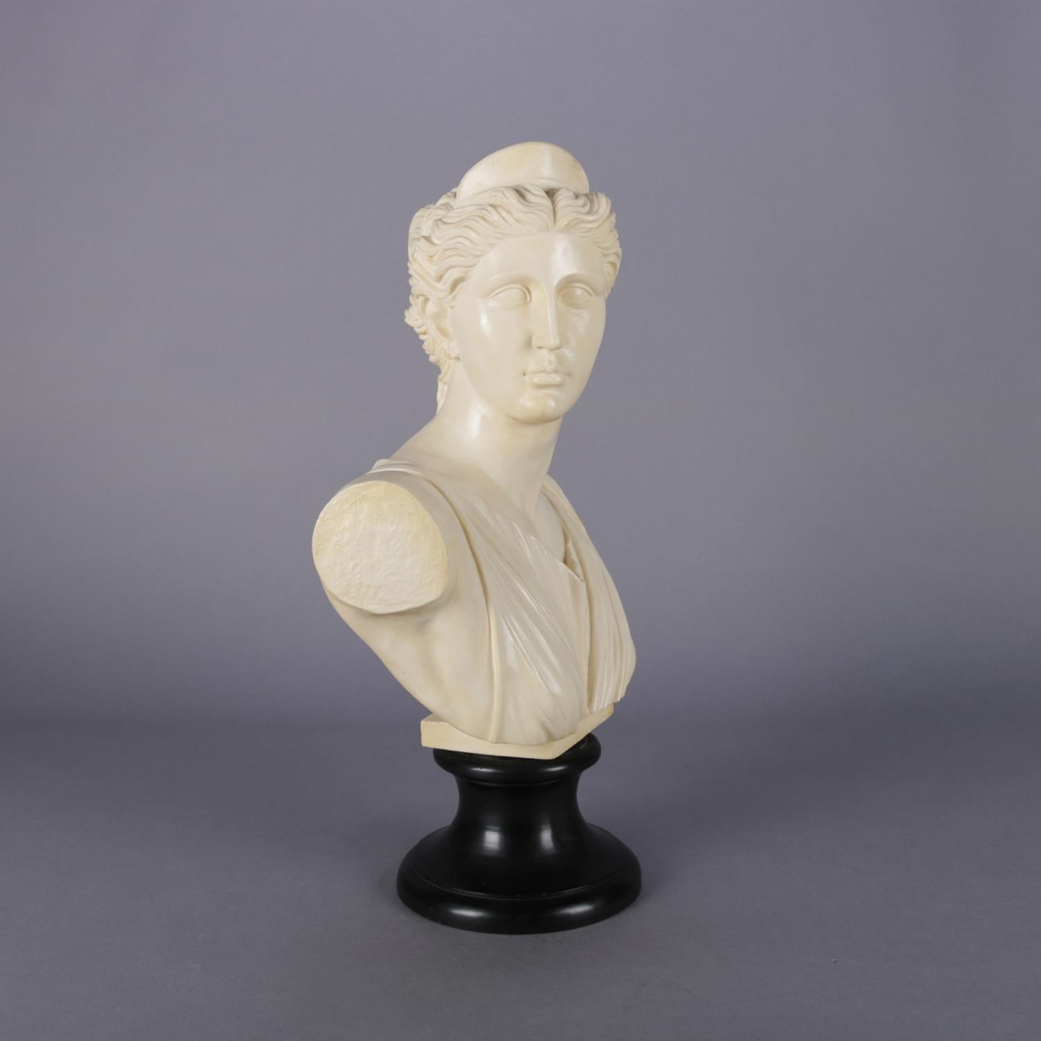 Italian resin portrait sculpture features bust of Artemis with gilt highlights and raised on painted plinth, signed A. Santini, 20th century

Measures: 20