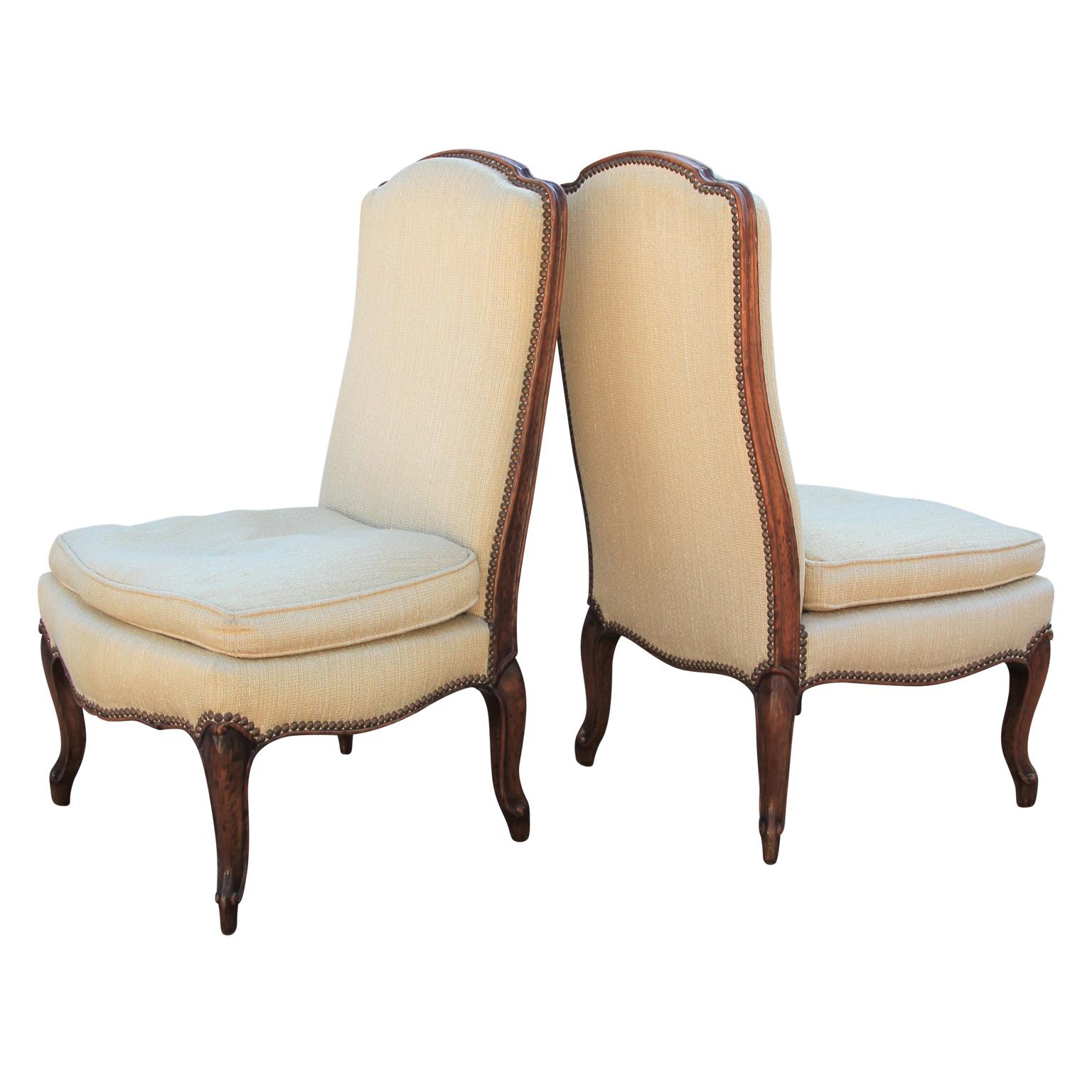 Wonderful little pair of Italian, possibly French slipper chairs. They are made out of a beautiful walnut. The fabric is vintage but usable. COM suggested for perfection. Excellent scale for small accent chairs.
  