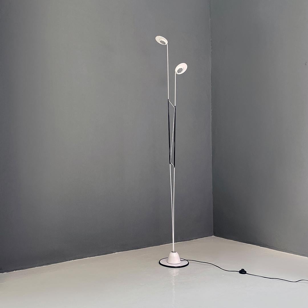 Italian post modern black and white two lights floor lamp, 1980s
Floor lamp with semi-spherical base with black and white striped motif from which two stems in white metal rod with different heights start, welded together by three other rods of