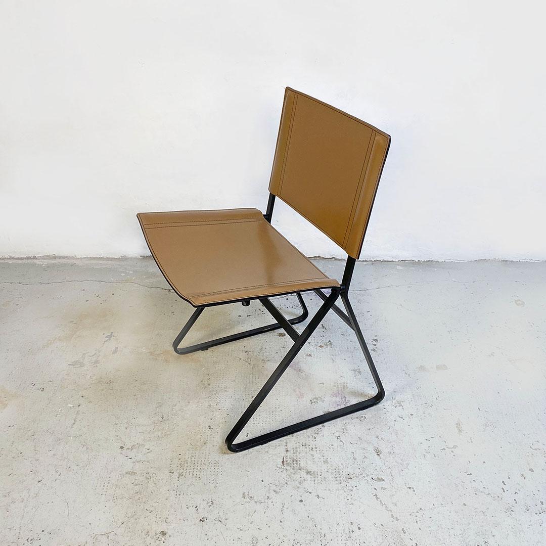 Italian post modern black metal and hazelnut leather chair, 1980s
Chair with black painted metal structure and with seat and back in hazelnut leather.
1980s
Good conditions.
Measurements in cm 47x58x76 and sitting 43h.