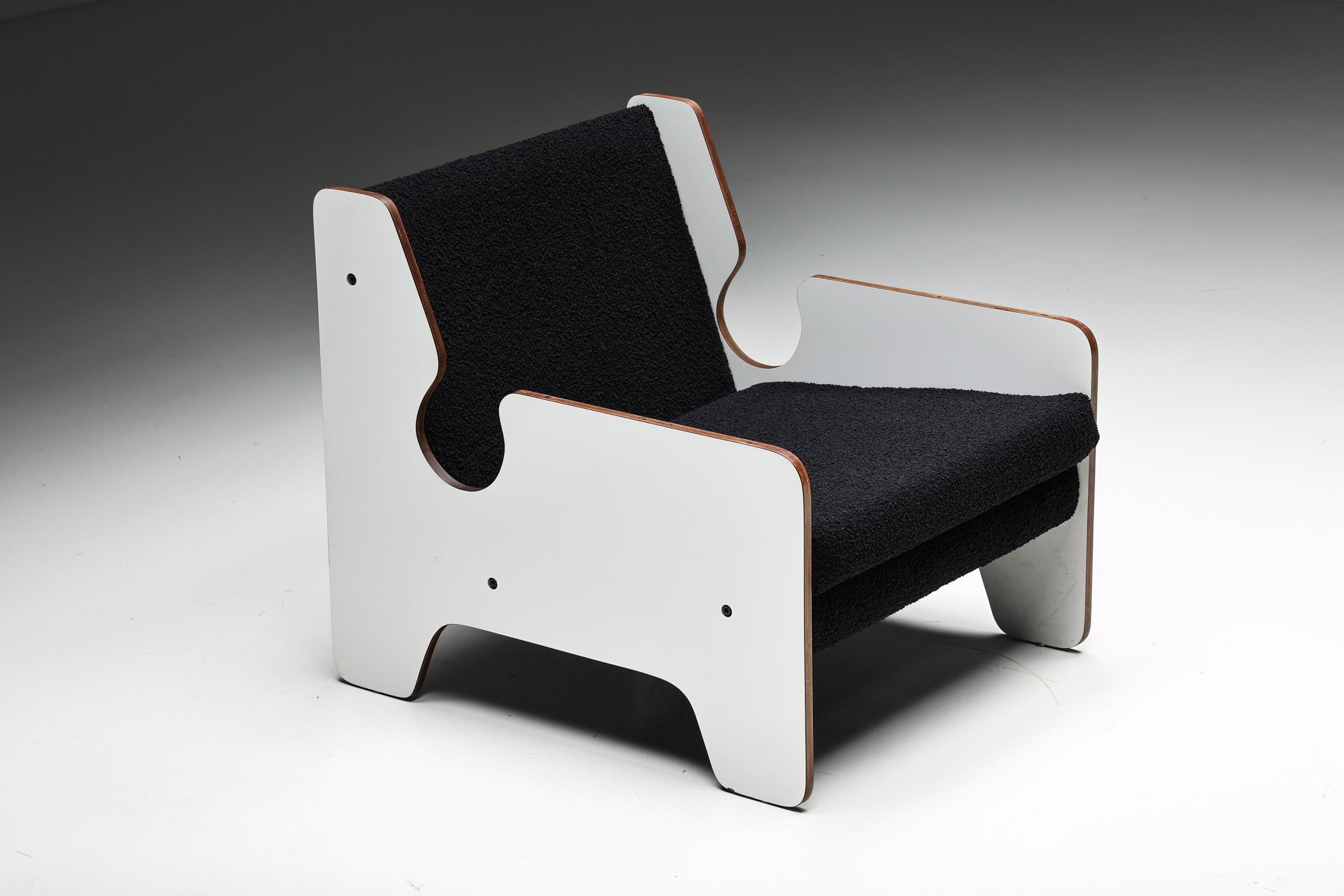 Italian postmodern black and white lounge chair, a beautiful piece of furniture that seamlessly combines the timeless elegance of the 1970s design era with a contemporary twist. Reupholstered in bouclé fabric, this unique chair is in excellent