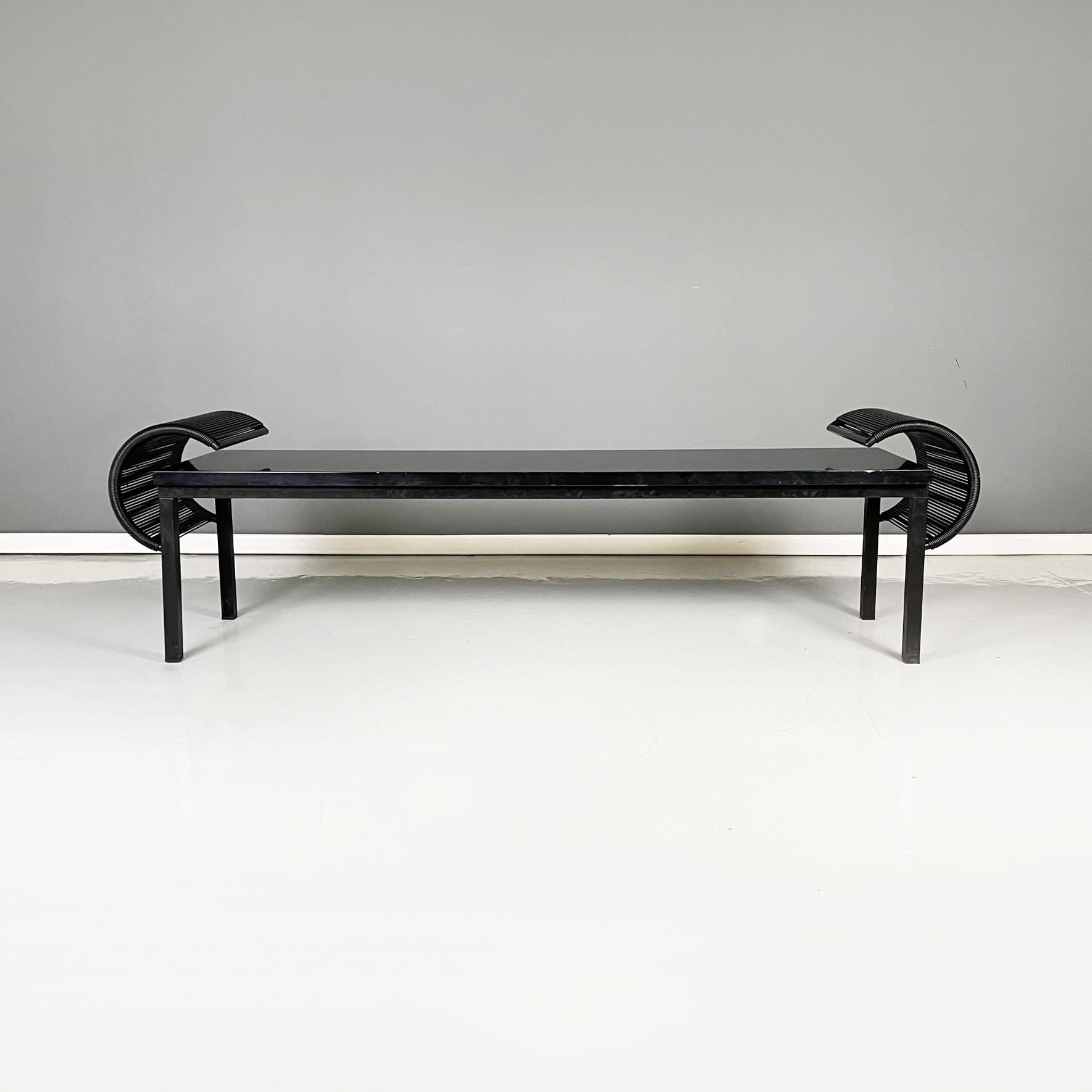 Italian post-modern Black wood, metal and plastic bench by Emilio Nanni for Fly Line, 1990s
Bench with rectangular seat in black lacquered wood. On the side, it has two C-shaped structures, with a black painted metal structure and braided black