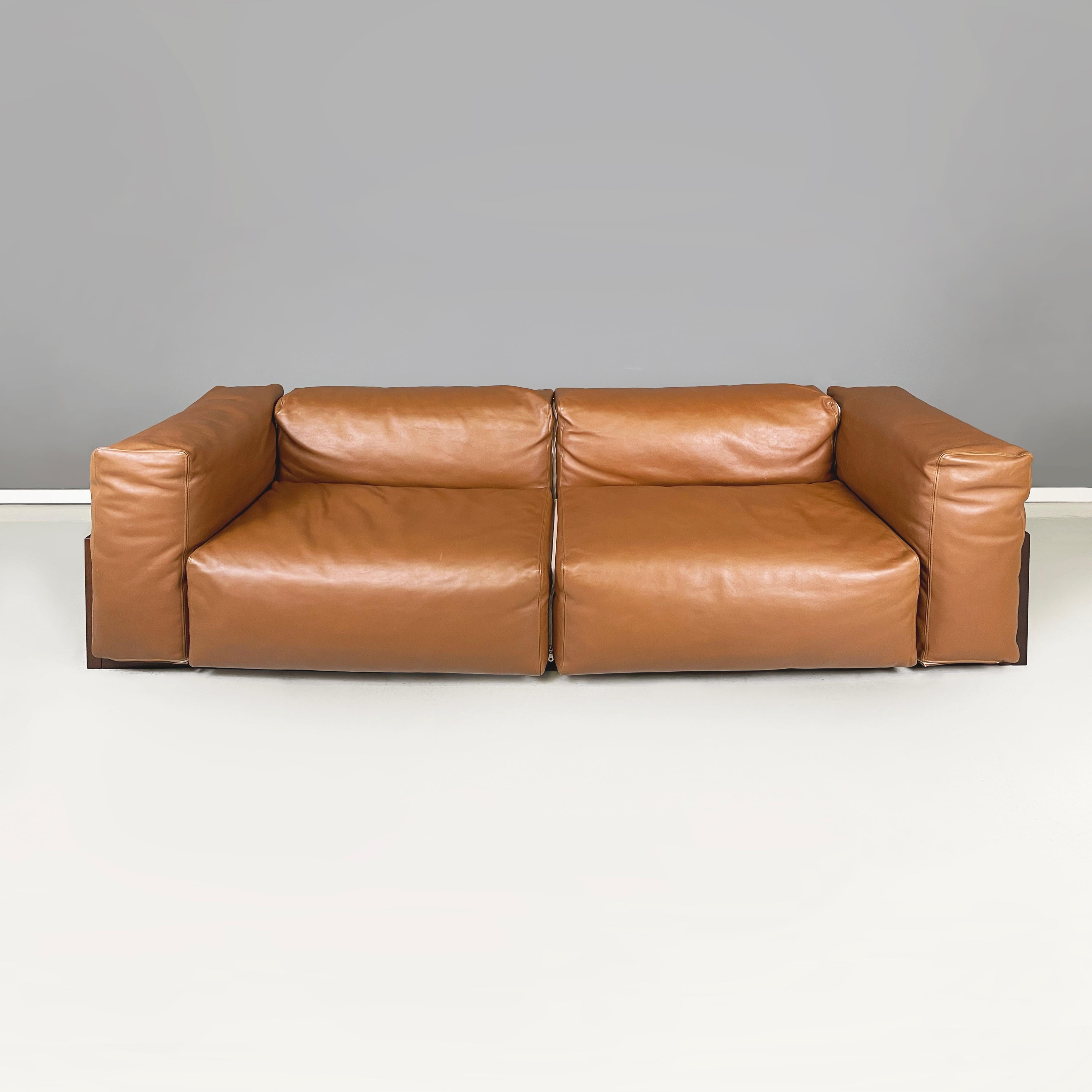 Italian post modern Brown leather and dark wood sofa by Cappellini, 2000s
Two seater sofa in brown leather. The square seat, backrest and armrest cushions are joined by a zip. The external structure of the sofa is in dark wood. 
Produced by
