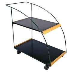 Carrito postmoderno italiano estantes de laminado negro y estructura de metal verde años 80