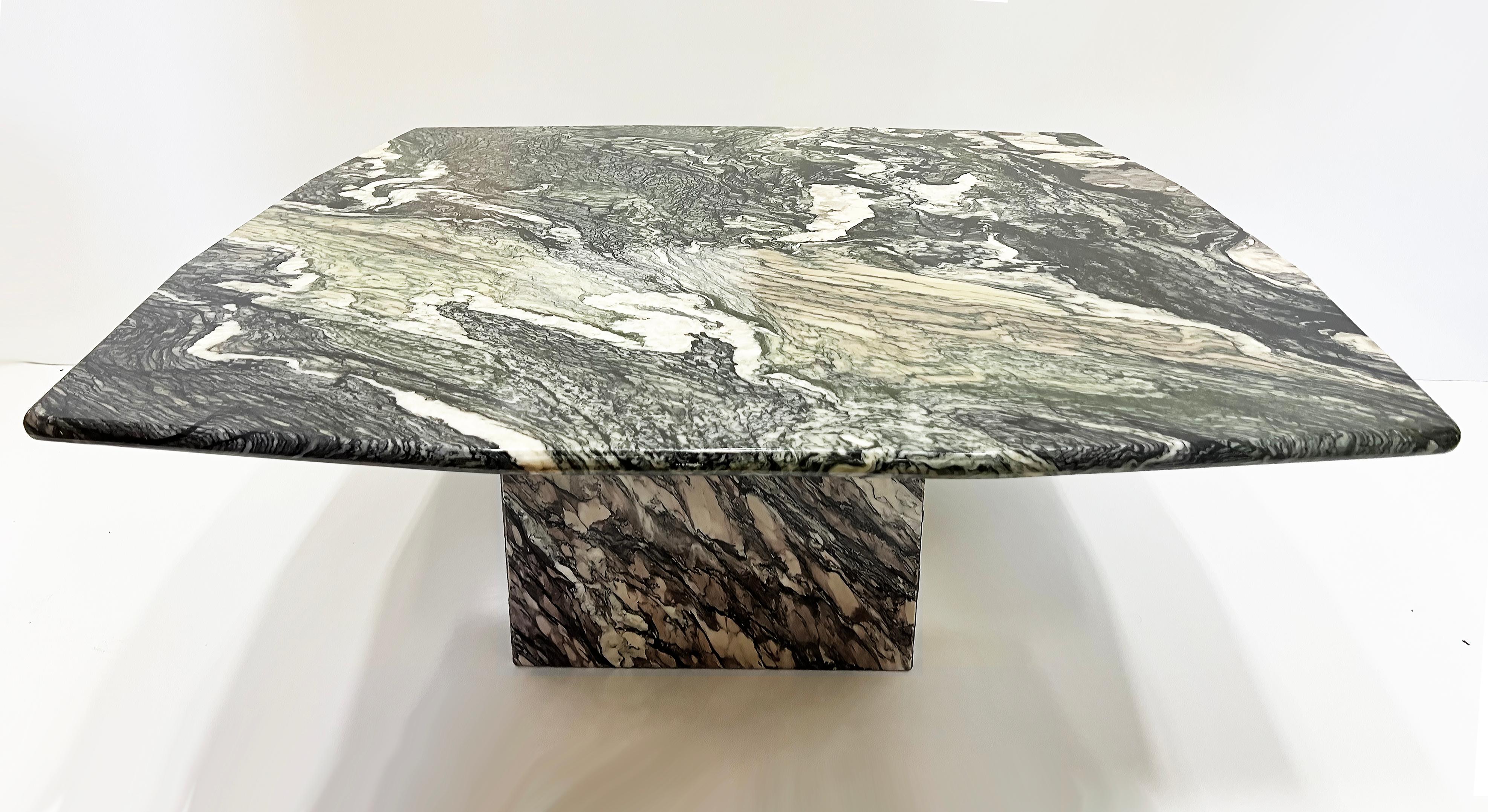 Italian Post-Modern Cipollino Ondulato Marble Coffee Table

Offered for sale is a stunning Italian Post-Modern coffee table created with exotic Cipollino Ondulato marble. Then unusually shaped top has flat edges that curve in slightly to each