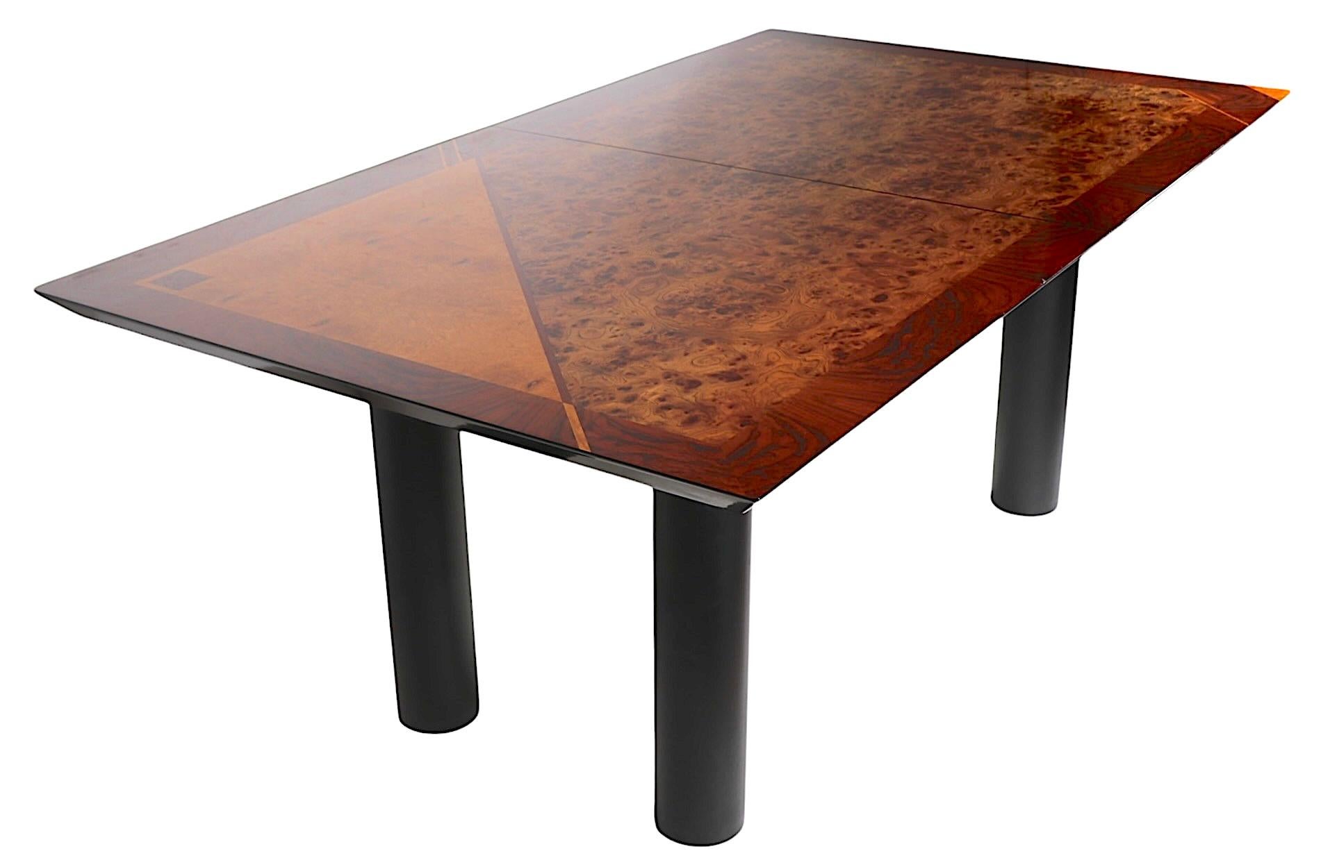 Voguish, chic and stylish dining table, designed by Oscar Dell Arredamento, made in Italy for Miniforms, circa 1970's. The table features a classic geometric  postmodern marquetry inlay top of burl, elm, and ash veneers on a dramatic high gloss top