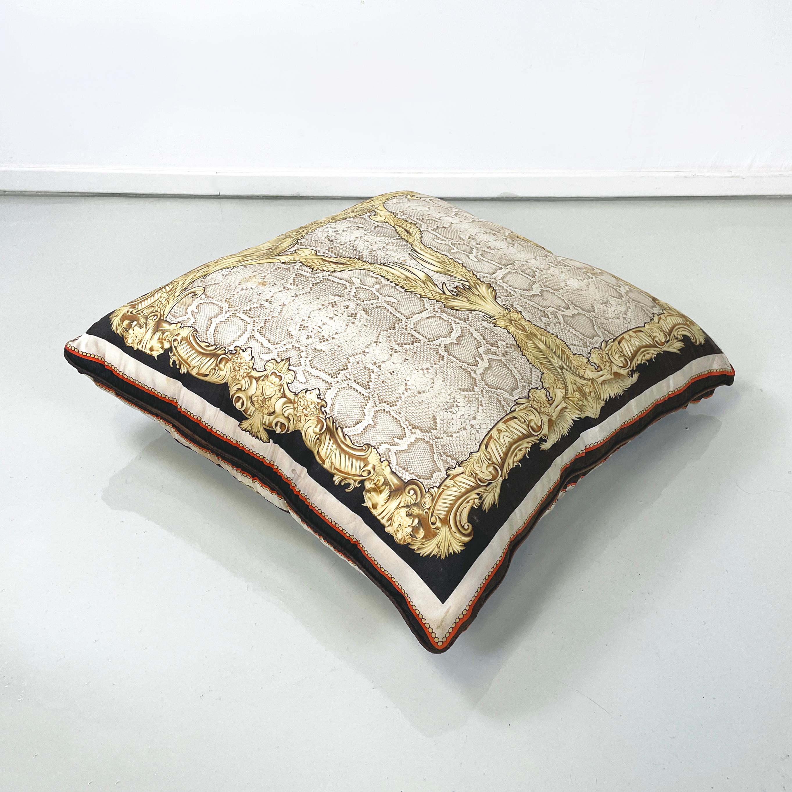 Italian post modern Fabric cushion with colored pattern by Roberto Cavalli, 2000s
Large square cushion in patterned fabric. In the center there is a crocodile print in beige tones, framed by motifs of feathered wings and feline figures, in yellow