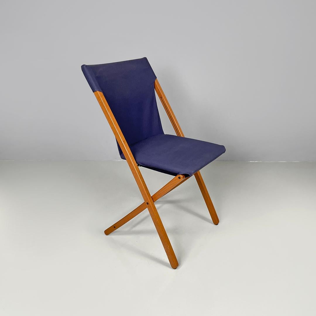 Italian post modern folding chair in wood and blue fabric structure, 1990s
Folding chair with wooden frame. The seat and backrest are made of a single blue fabric structure, which 