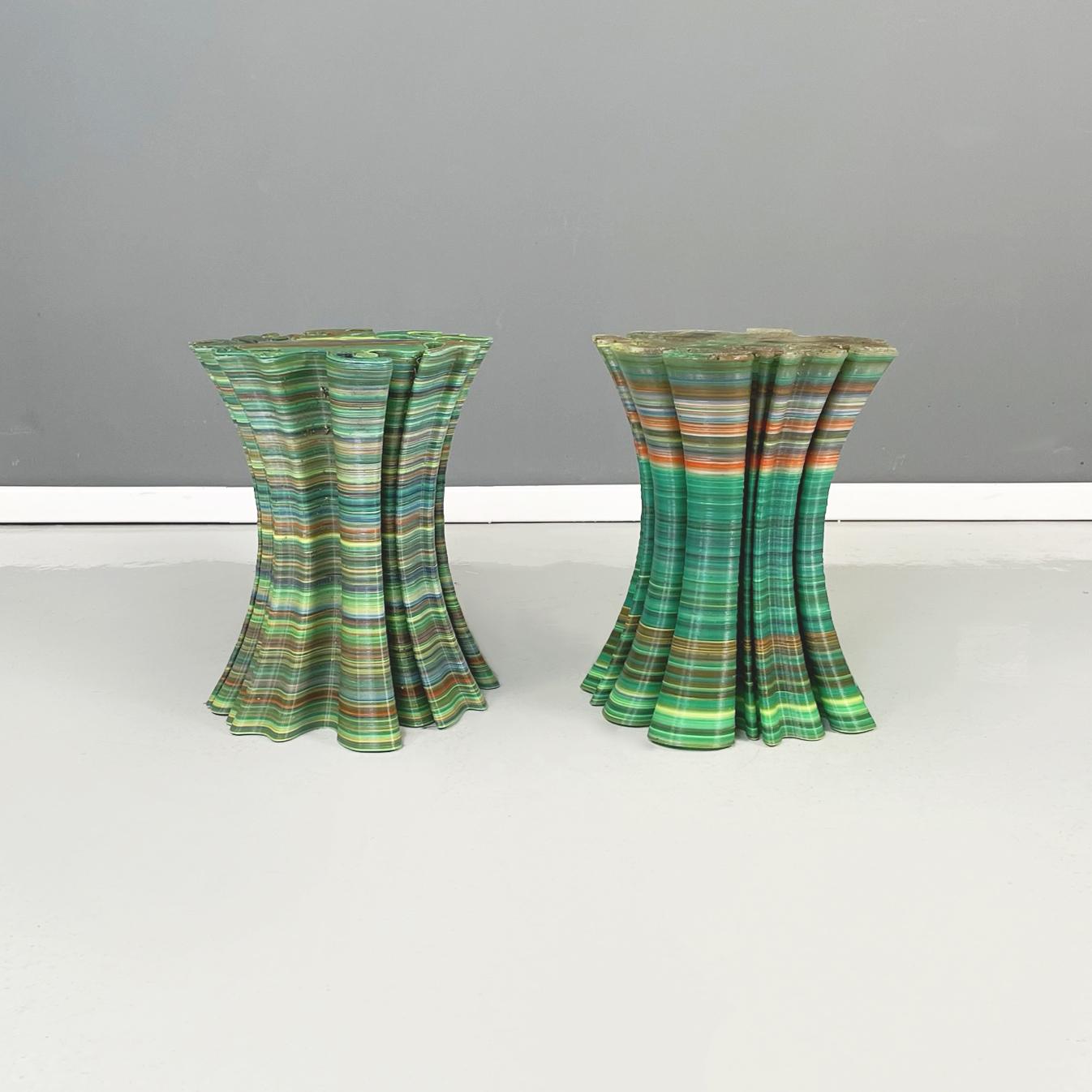 Italian post-modern Garden stools or coffe tables in colored plastic, 2000s
Pair of coffee tables of irregular shape, entirely in plastic of different shades: green, yellow, orange and blue. The table narrows in the center and widens at the ends.