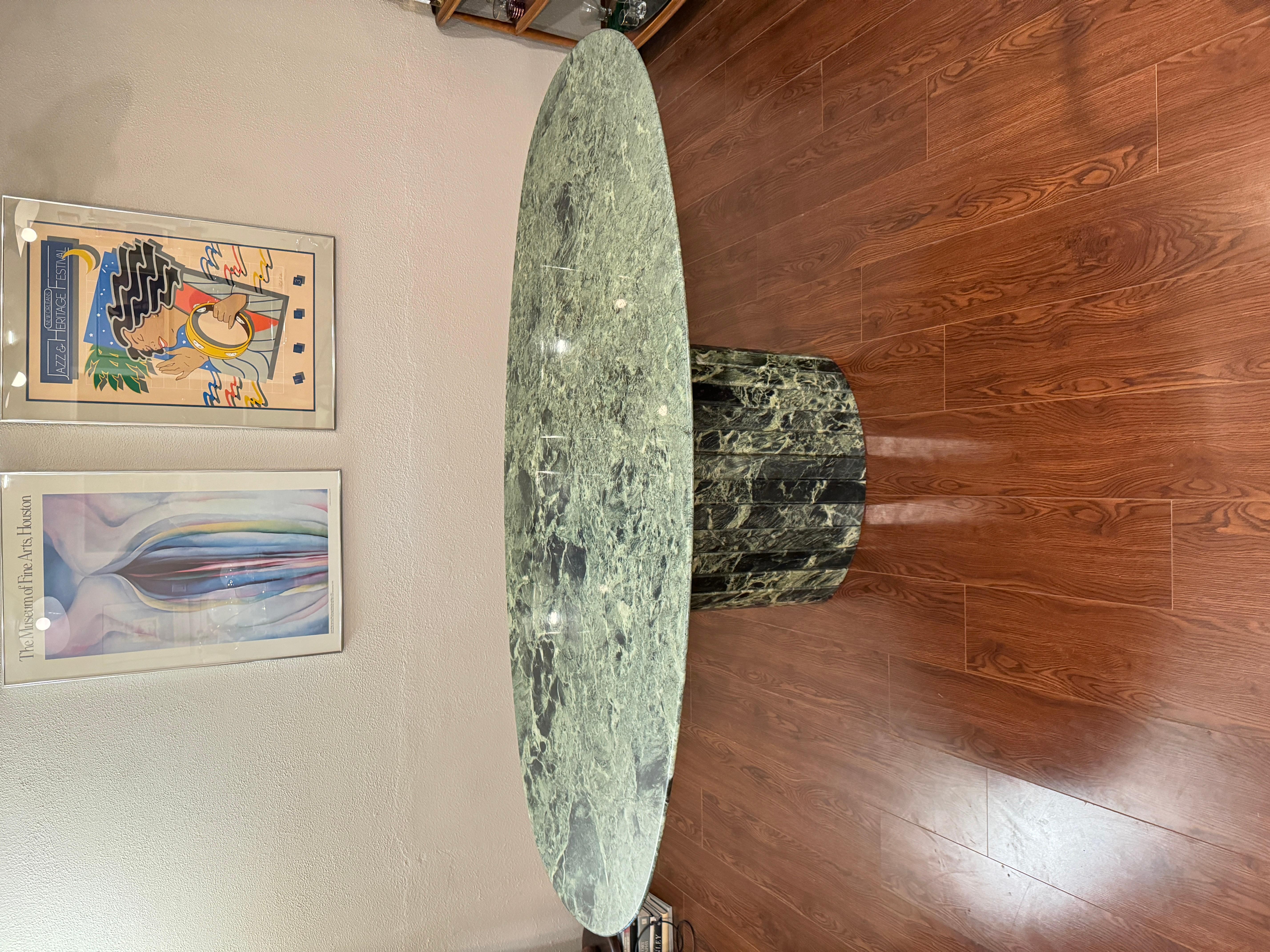 Gorgeous post modern green oval marble dining table by Roche & Bobois. Has a pedestal paneled base. Made in Italy circa 1970s. In very good original condition, with no chips or cracks. Just some minor scratching on the surface and expected wear from