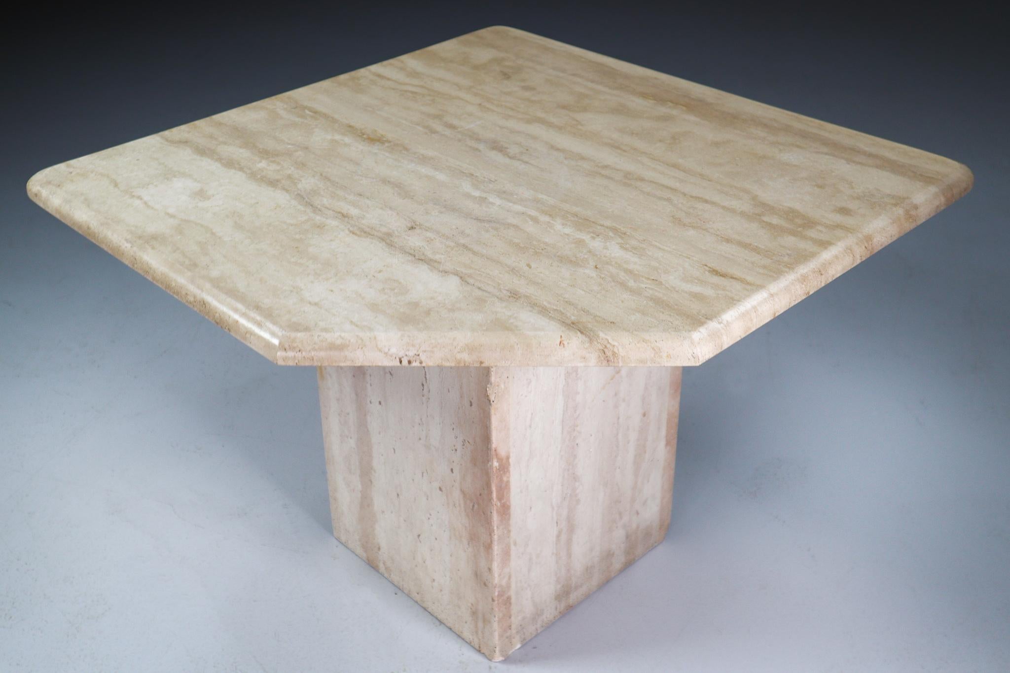 This beautiful post-modern travertine side, coffee table, circa 1970s, has beautiful graining and pentagonal top. This sculptural travertine side table would work great in a Traditional, Transitional, Hollywood Regency, classical or Art Deco room