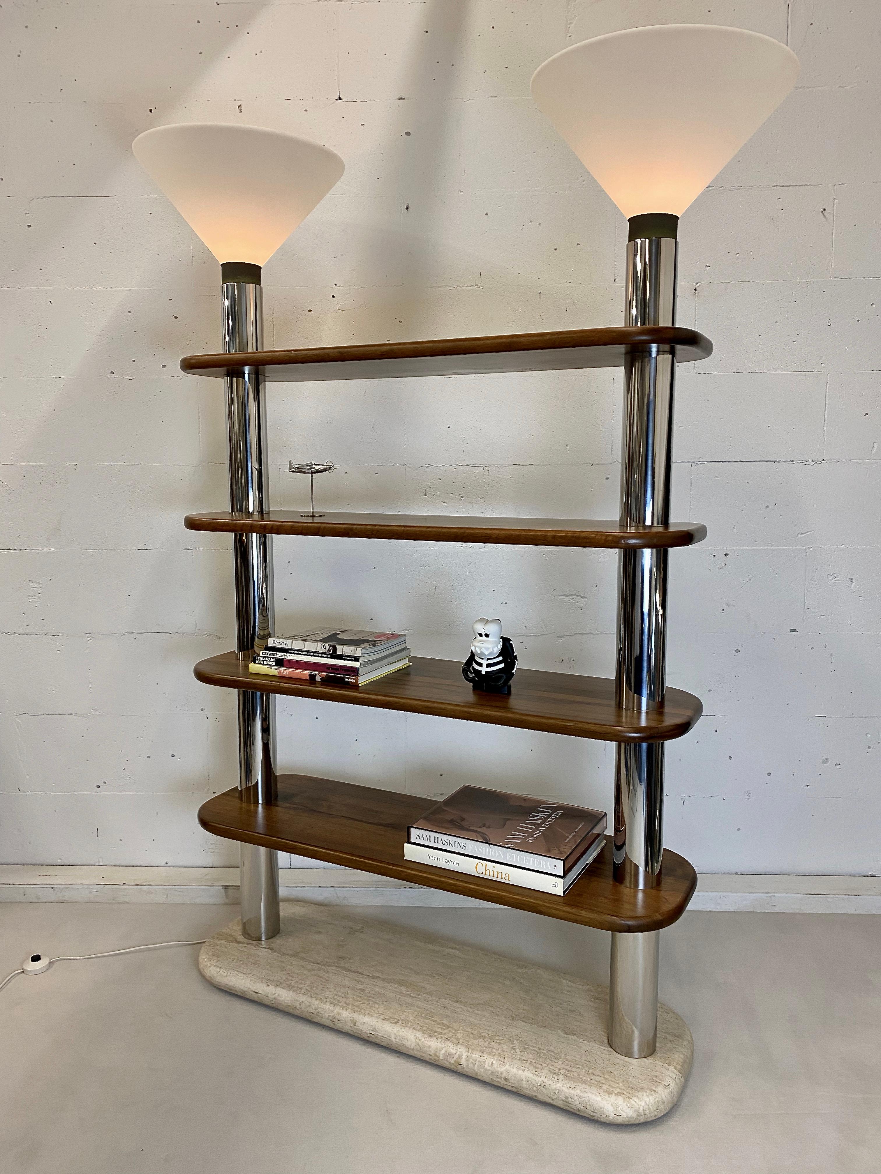 Stylish and sleek Italian made post modern bookcase / etagere with oversized Lamp shades. 
This rare piece is in fantastic condition. It is made of a solid Travertine base and wooden shelves which are connected with polished stainless steel tubes.