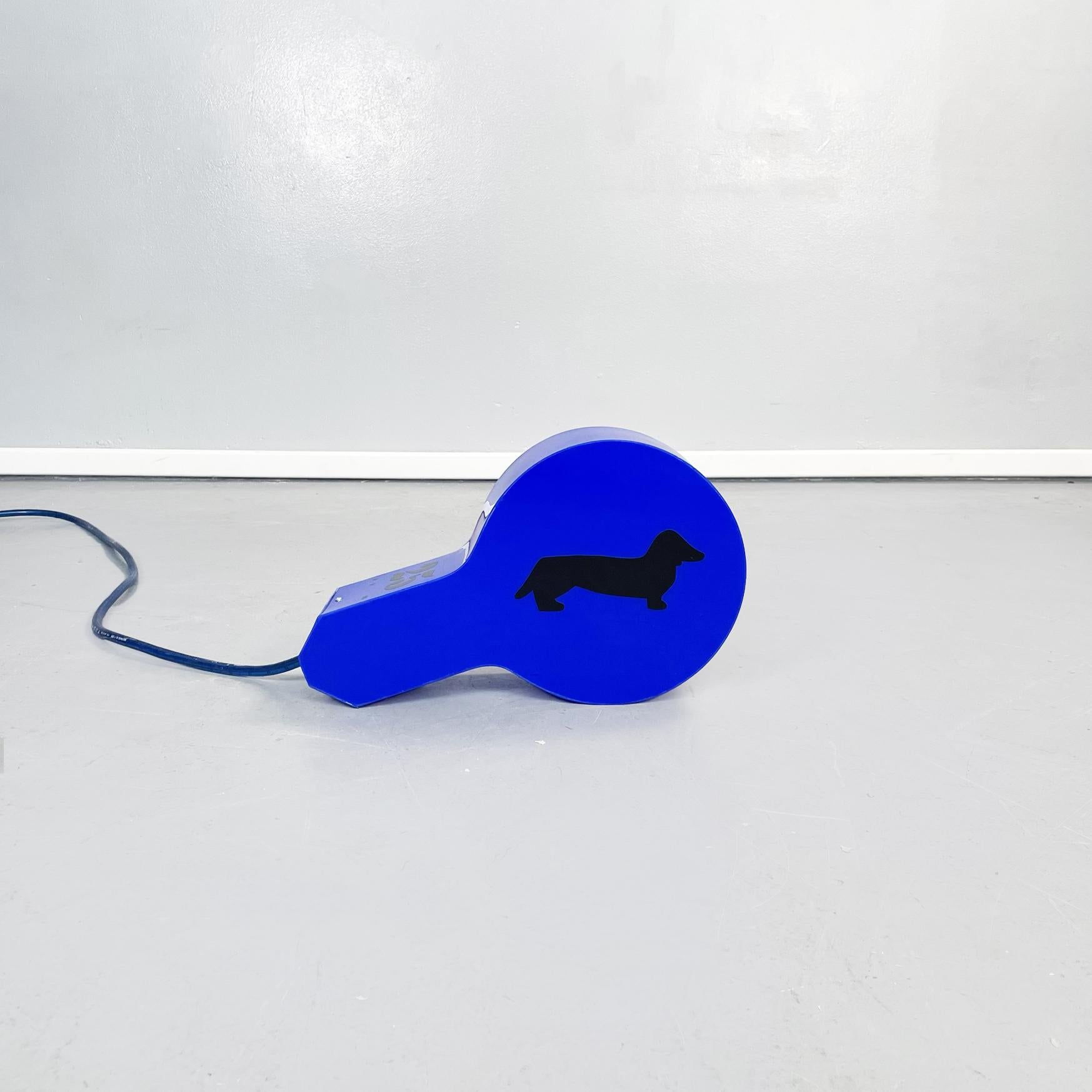 Italian post-modern Whistle-shaped led table lamp in blue plexiglass by Marco Lodola, 2000s
Fantastic and impressive whistle-shaped led table lamp in bright blue plexiglass with a dachshund dog.
There are on the side a silhouette in black of a