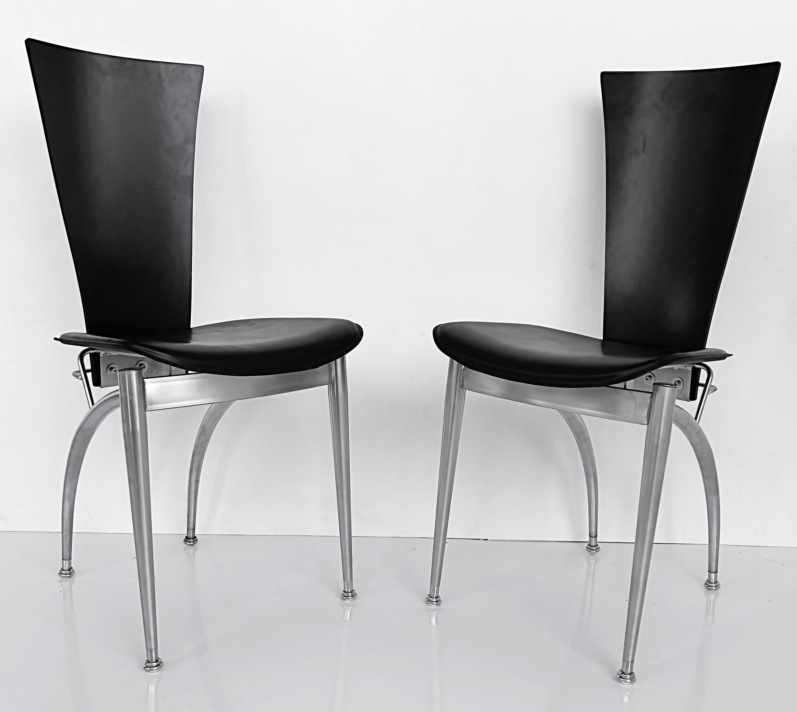 Italian Post-Modern Wood, Leather, Stainless Dining Chairs, Set of 4

Offered for sale is a set of four black Italian Post Modern dining chairs with stainless steel frames. The backs of the chairs are wood and the seats are black. The stainless