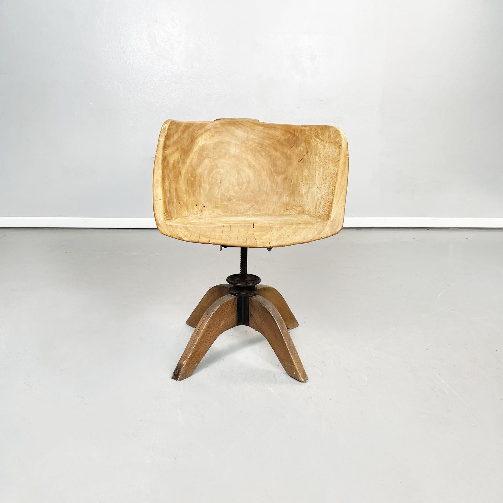 Italian post-modern Wooden armchair, 2000s
Armchair with wooden semicircle seat in brasilian wood. 
The backrest, armrests and seat are a single piece of worked wood, with rounded edges. The base is composed of a metal rod, which allows the chair to