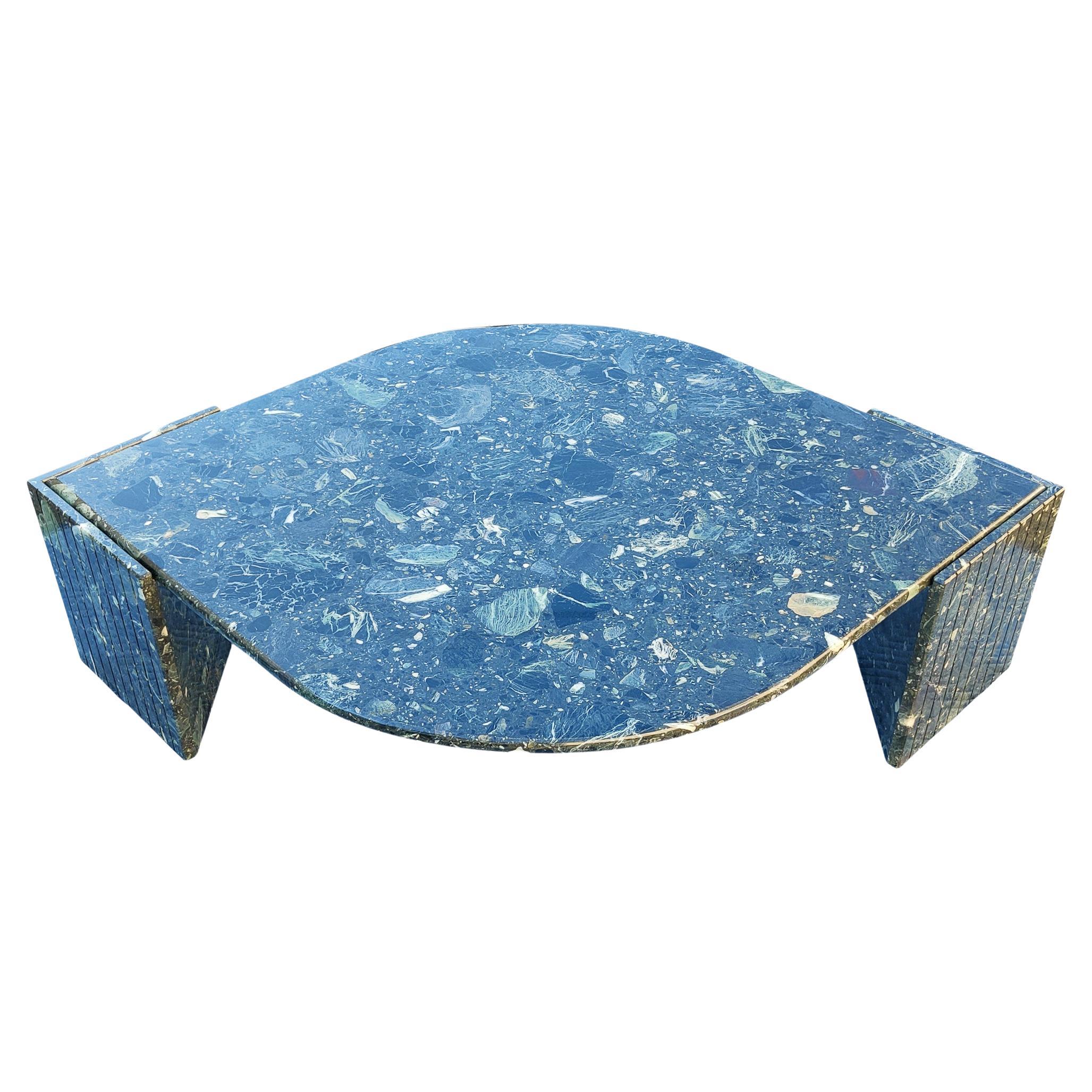 This rare Italian marble table is, unlike many others, made of breccio marble. Sitting on two very heavy V-shaped blocks, it stands very stable. The color and graining in the marble is amazing. Predominantly dark green, with lighter shades of green.