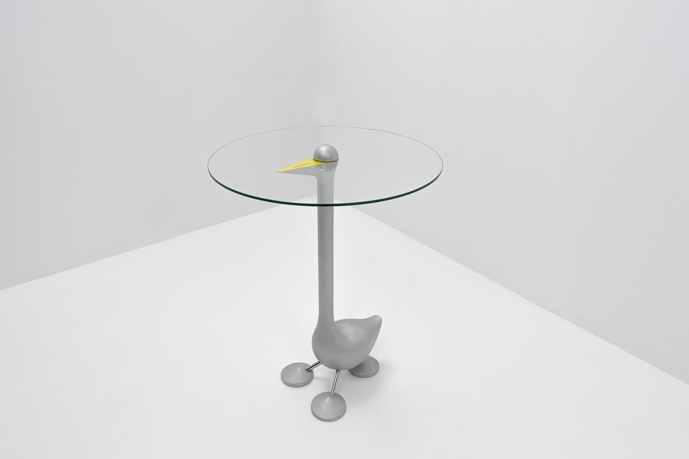 A goose shaped “Sirfo” side table designed by Alessandro Mendini for Zanotta during the 1980s. Tempered glass top on a solid aluminum base.

Mendini (1931 – 2019), was a well respected Italian designer and architect who was particularly known for