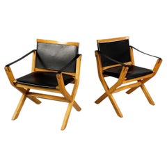 Italian postmodern armchairs Kiu in wood and black leather for Luxoritalia 2020s
