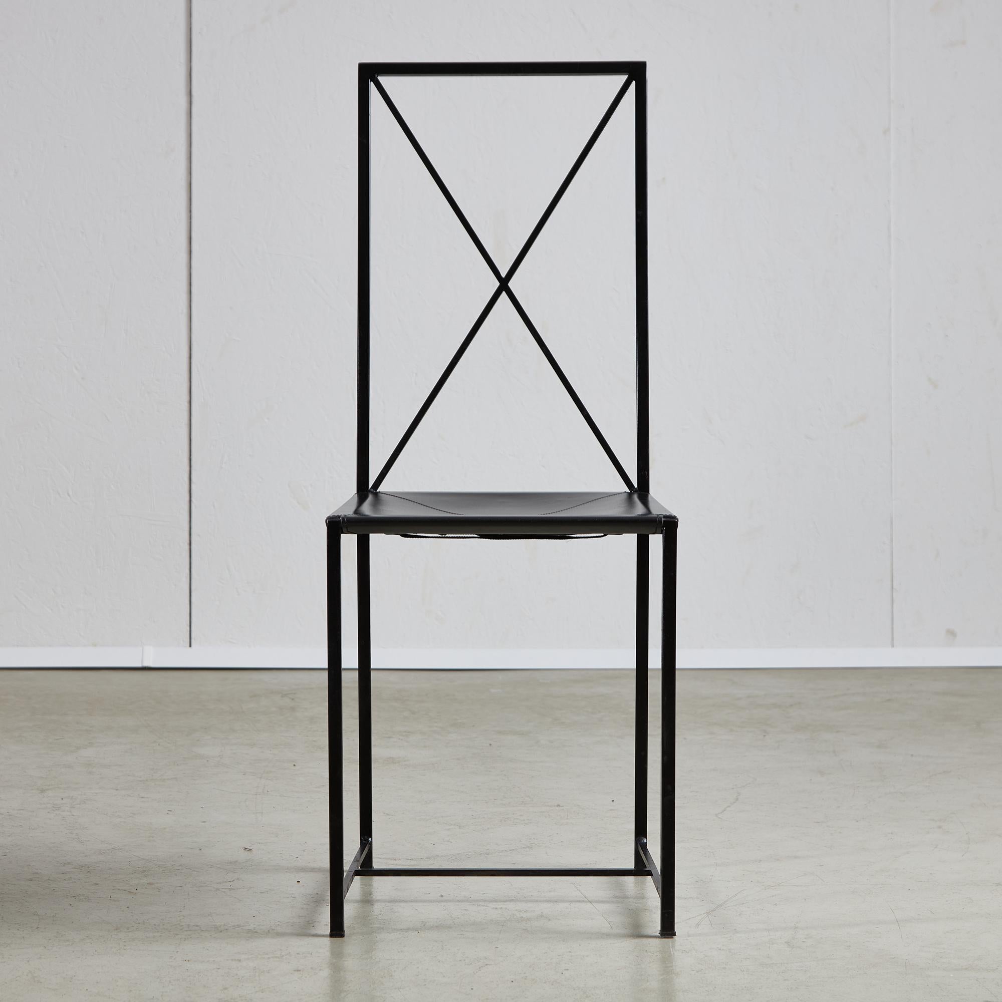This chair features a postmodern design characterized by a metal frame and a leather seat. The backrest is uniquely shaped in an X form, also crafted from metal. This overall design creates a feeling of lightness and simplicity, merging a sturdy