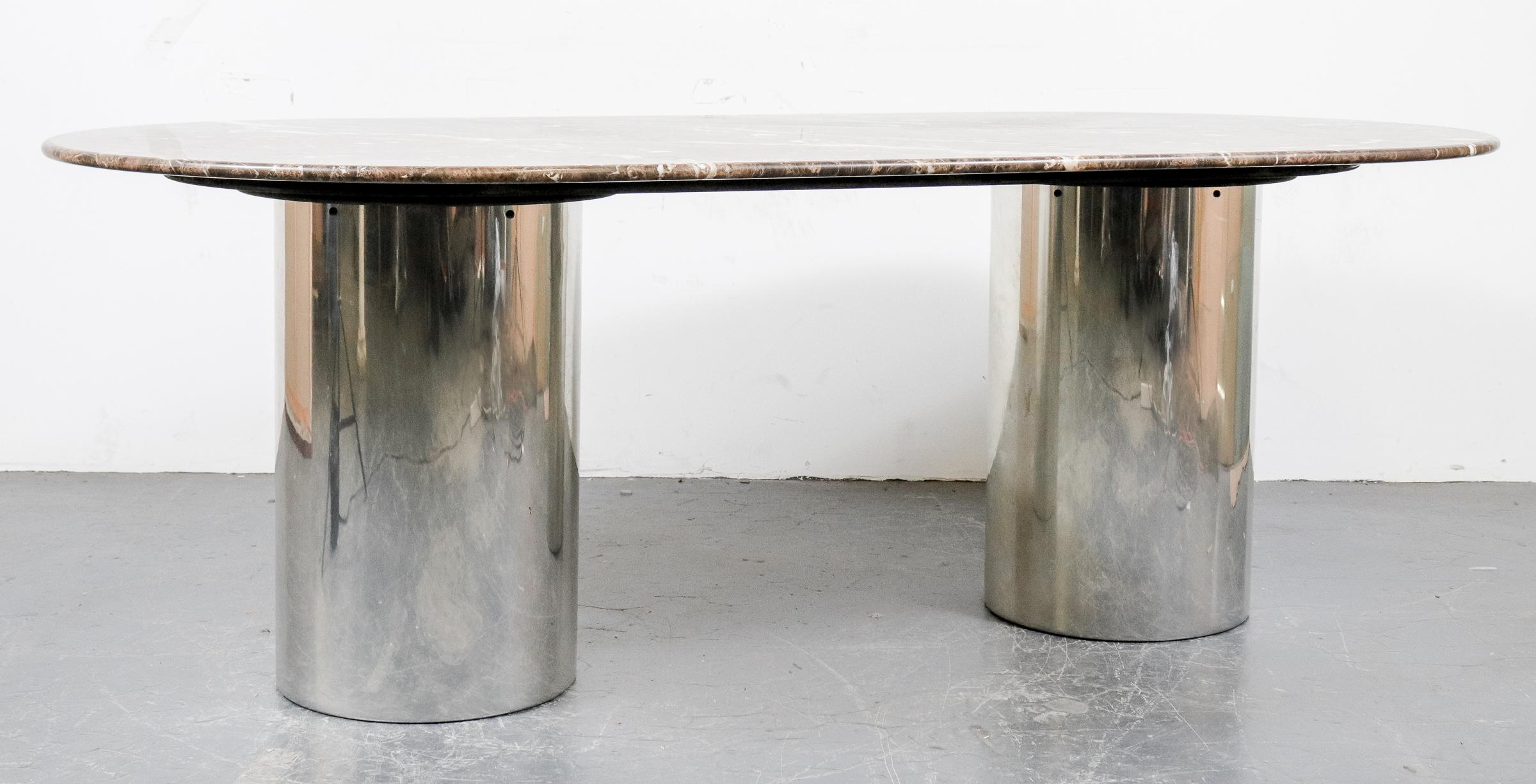 Italian Postmodern dining table featuring oblong dark Emperador marble over double chrome cylindrical pedestal base. Measures: 30