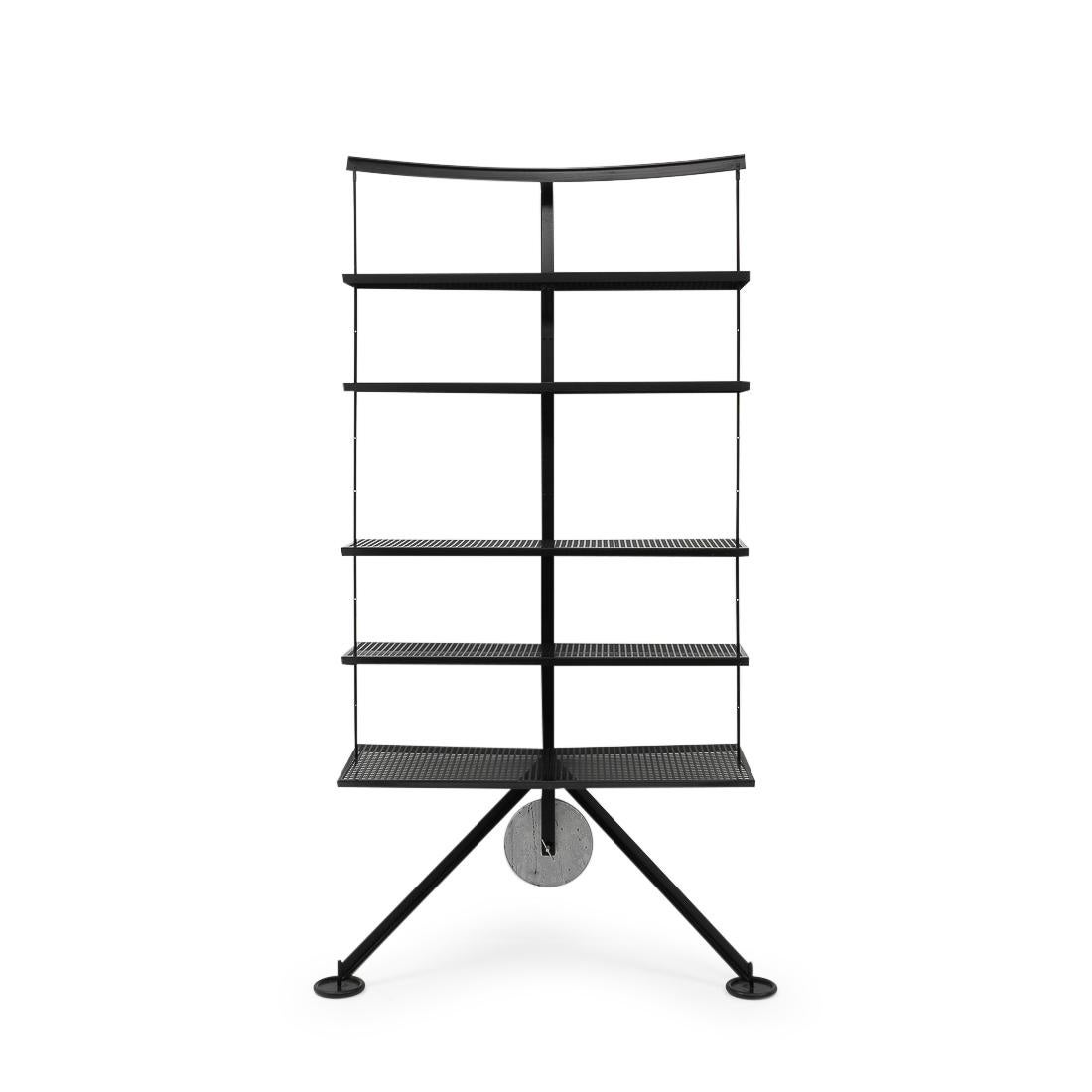 A 1980s book shelf designed by Carlo Forcolini for Alias, inspired by temple doors in Japan and China. This version is no longer in production. 

The Ran bookcase consists of five perforated black metal shelves, adjustable in height. It is