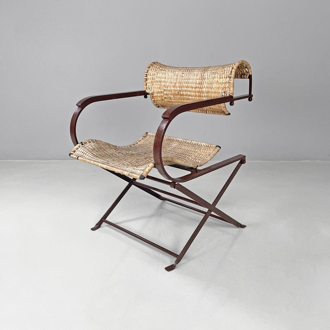 Italian postmodern folding chairs in straw and brown metal, 2000s
Set of four chairs in straw and brown painted metal with a glossy finish. The backrest bends to form a semicircle line, and the seat is also curved and rounded. The supporting