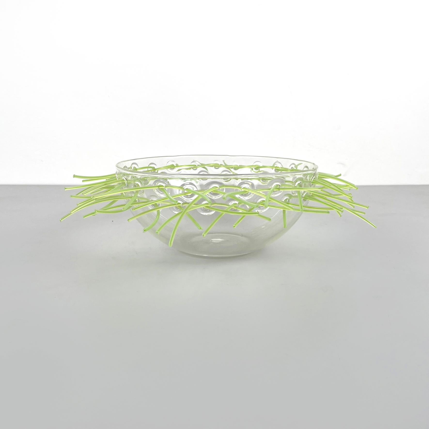 Italian post-modern Glass and green plastic Pocket emptier bowl by Cleto Munari, 2000s
Hemispherical pocket emptier bowl in perforated glass. There are small threads of light green plastic in the holes. Can be used as a centerpiece.
Produced and