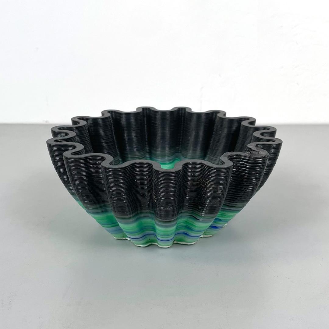 Italian postmodern irregular wavy plastic green black bowl pocket emptier, 2000s
Irregularly shaped bowl with wavy edges. Entirely made in plastic of different shades: green, blue, gray and black. It can also be used as a pocket emptier or as a