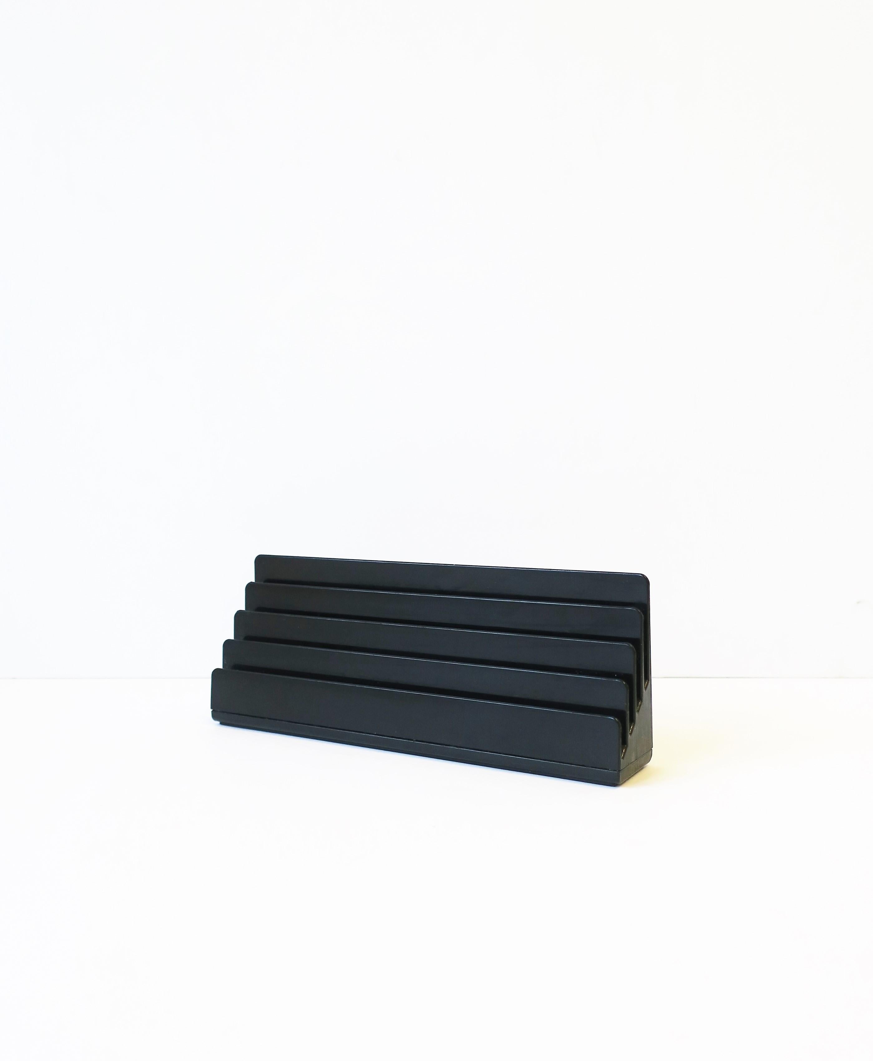 An Italian Postmodern black letter holder or desk organizer by designer Rino Pirovano for Rexite, Italy, circa late-20th century. Piece is marked on bottom as shown in images #9 and 10; 