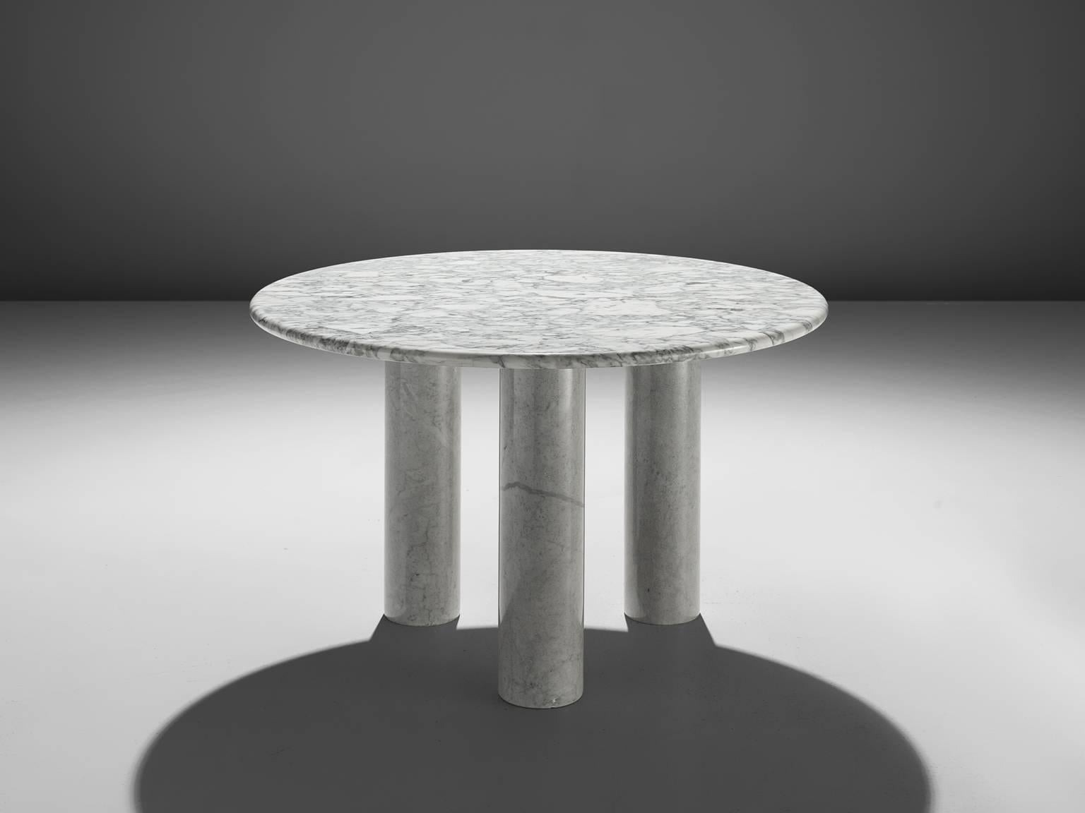 Breakfast table, marble, Italy, 1970s. 

This architectural table is a skillful example of postmodern design. The circular table features no joints or clamps and is architectural in its structure. The table rests on the three column-like legs. The