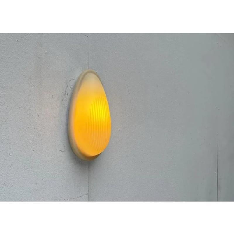 Markant wall lamp from the Italian manufacturer Arteluce/I flated a draft from Marc Sadler from the early 90s.

A functional lamp and a striking object of special materiality. The front of a silicone elastomer is elastic and determined by